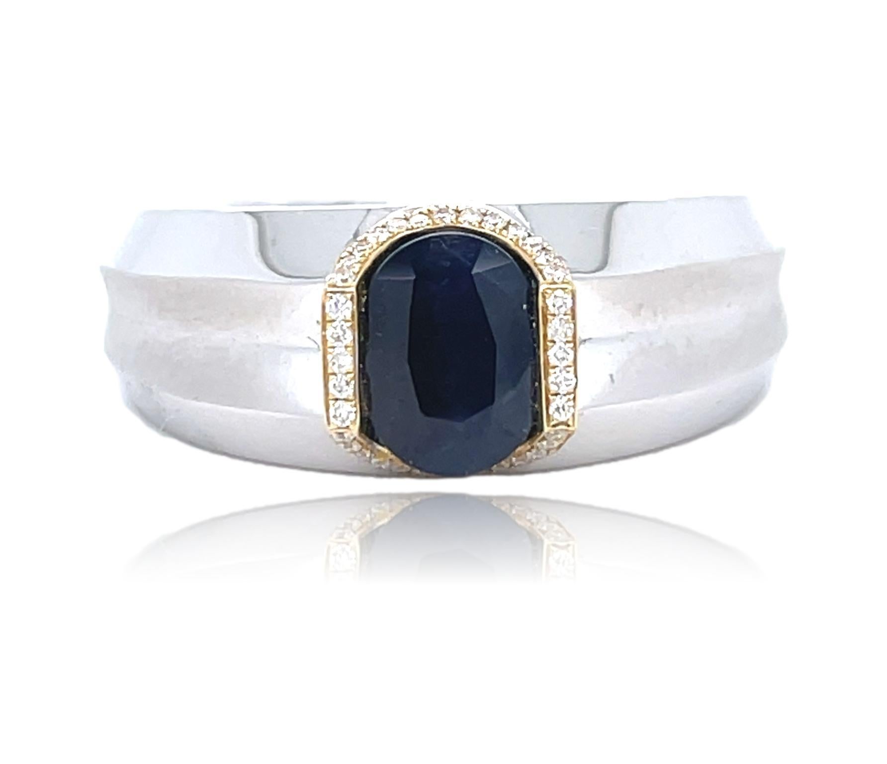 This unique Men's ring has a deep blue oval cut Sapphire surrounded by top quality brilliant cut diamonds  and is set in 14K white and yellow gold. It comes in a beautiful box ready for the perfect gift!

14KWY:            9.60 gms
Sapphire wt:   