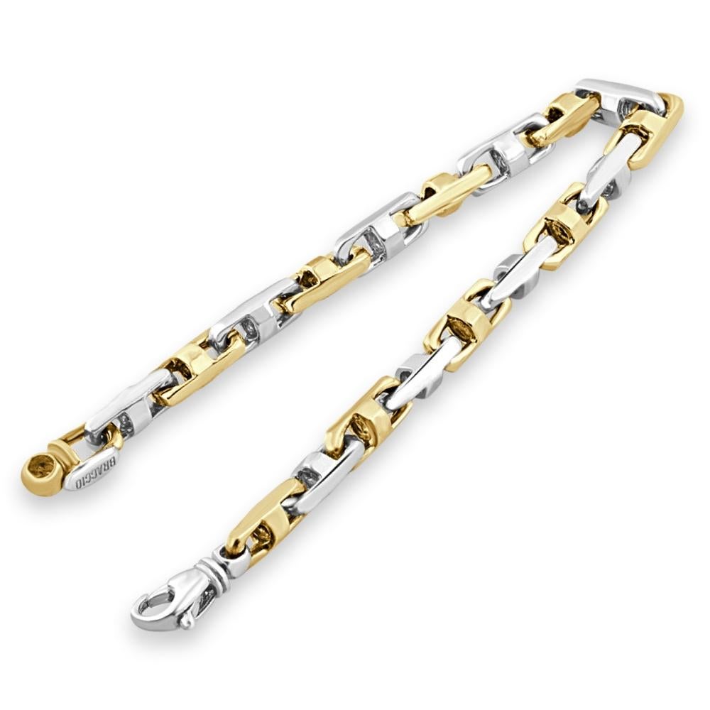 This stunning men's bracelet is made of solid 14k yellow/white gold.  The bracelet weighs 38 grams and measures 8.5