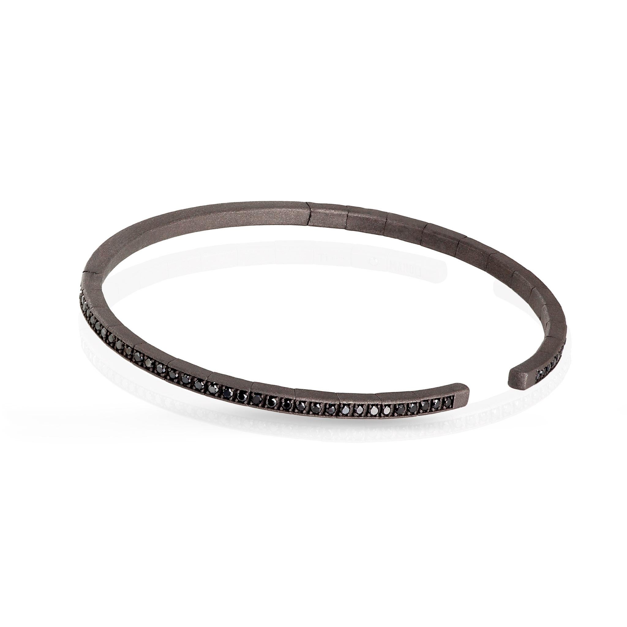 Men's titanium bracelet all set with 99 black diamonds. Elastic structure bracelet featuring a long series of 99 black diamonds for a total carat of 99 points running through part of the entire bracelet. On the inside, a 1-point black diamond has