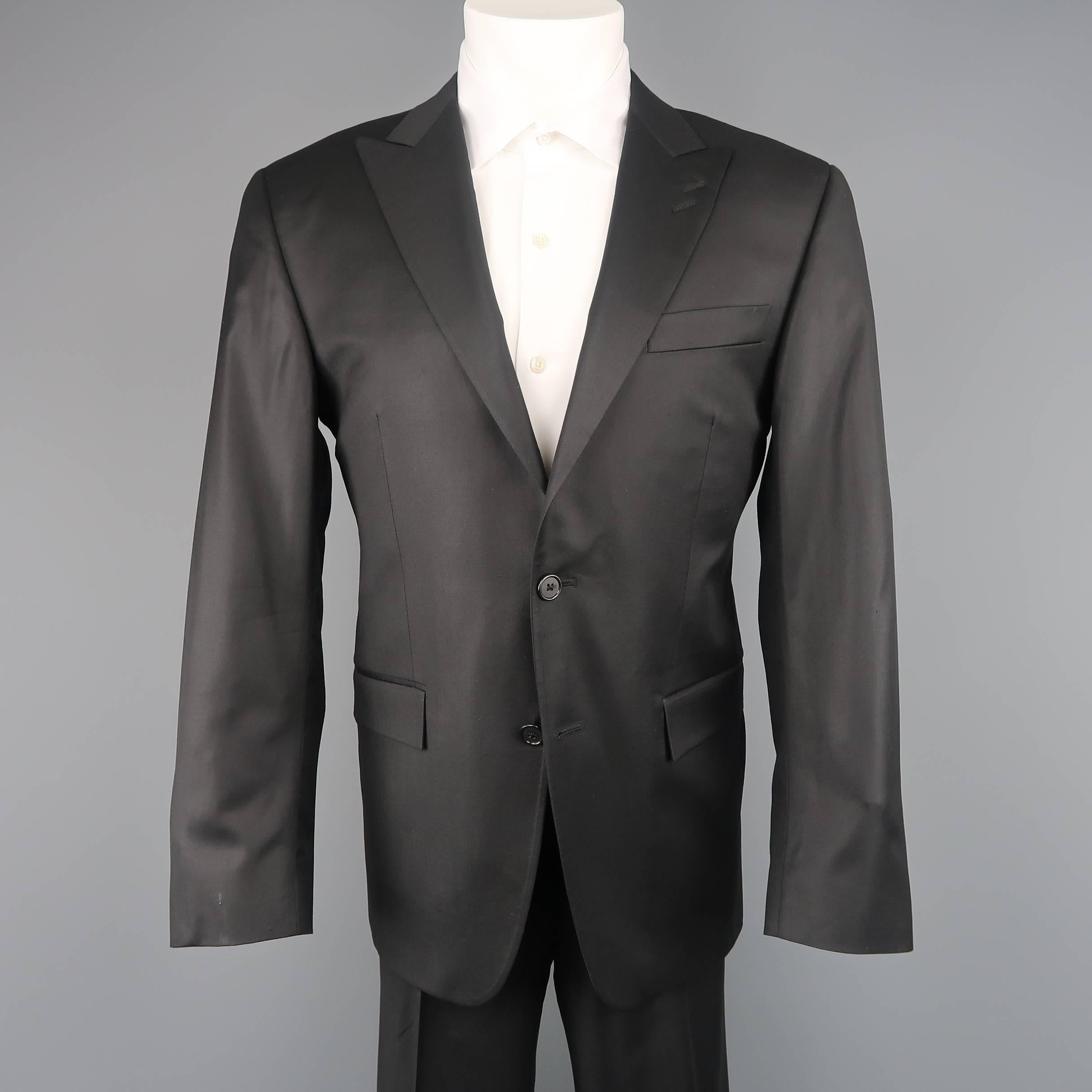 Two piece suit by SPURR comes in black wool with a subtle sheen and includes a single breasted two button sport coat with peak lapel and matching flat front trousers.  Made in USA.
 
Excellent Pre-Owned Condition.
Marked: 40 REG
 
Measurements:
