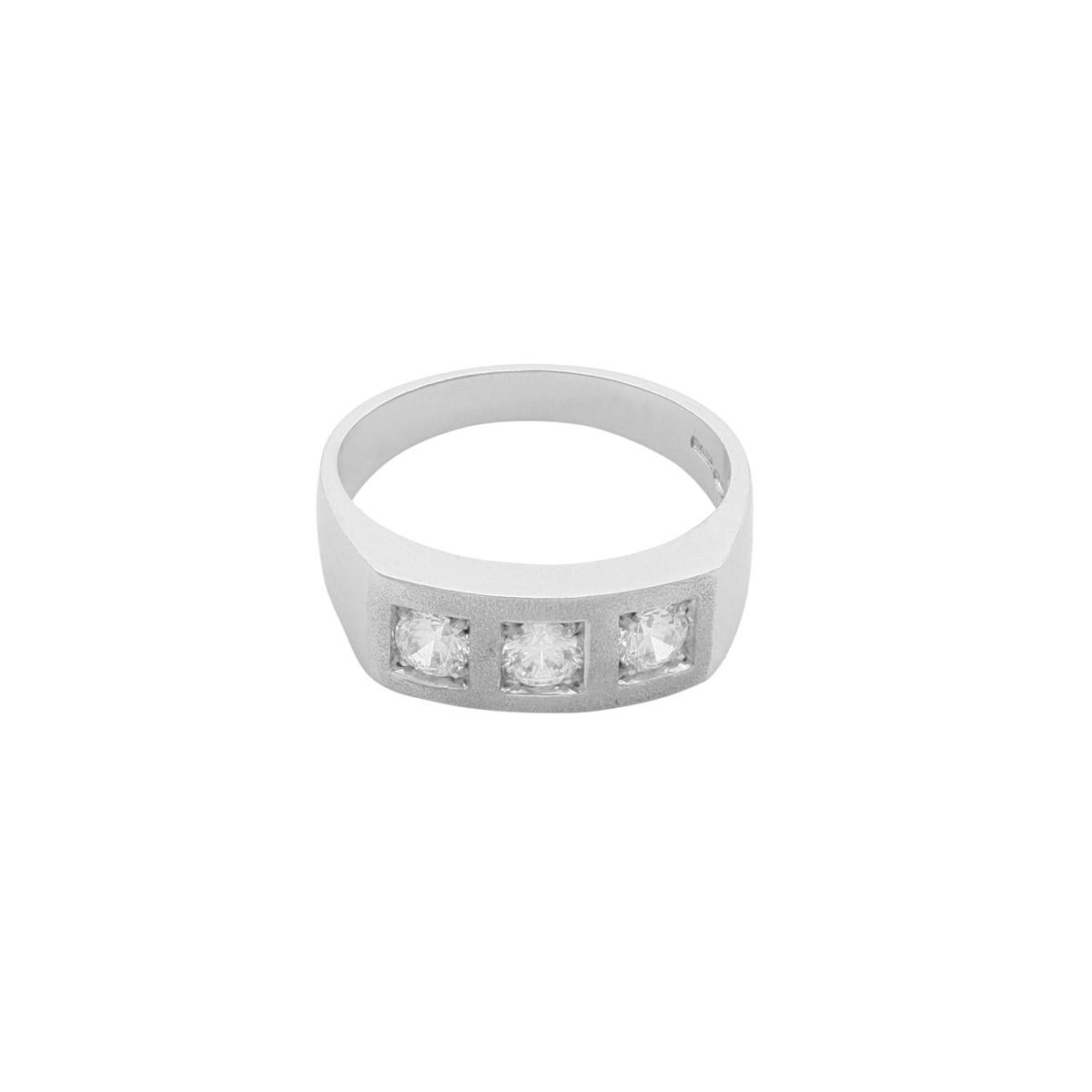 This innovative, squared trilogy ring is crafted in platinum with a matt finish. It features three white diamonds in a bright-cut setting. Representing the past, present, and future, trilogy rings have the ability to tell the story of your journey