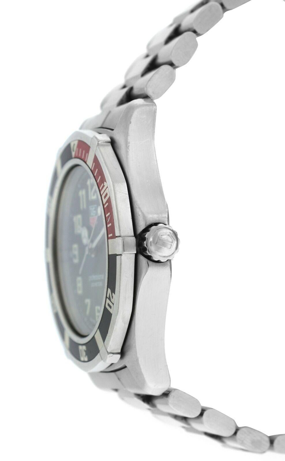 Brand	Tag Heuer
Model	WM1112
Gender	Men's
Condition	Pre Owned
Movement	Quartz
Case Material	Stainless Steel
Bracelet / Strap Material	Stainless Steel
Clasp / Buckle Material	Stainless Steel
Clasp Type	Deployment
Bracelet / Strap width	20 mm at