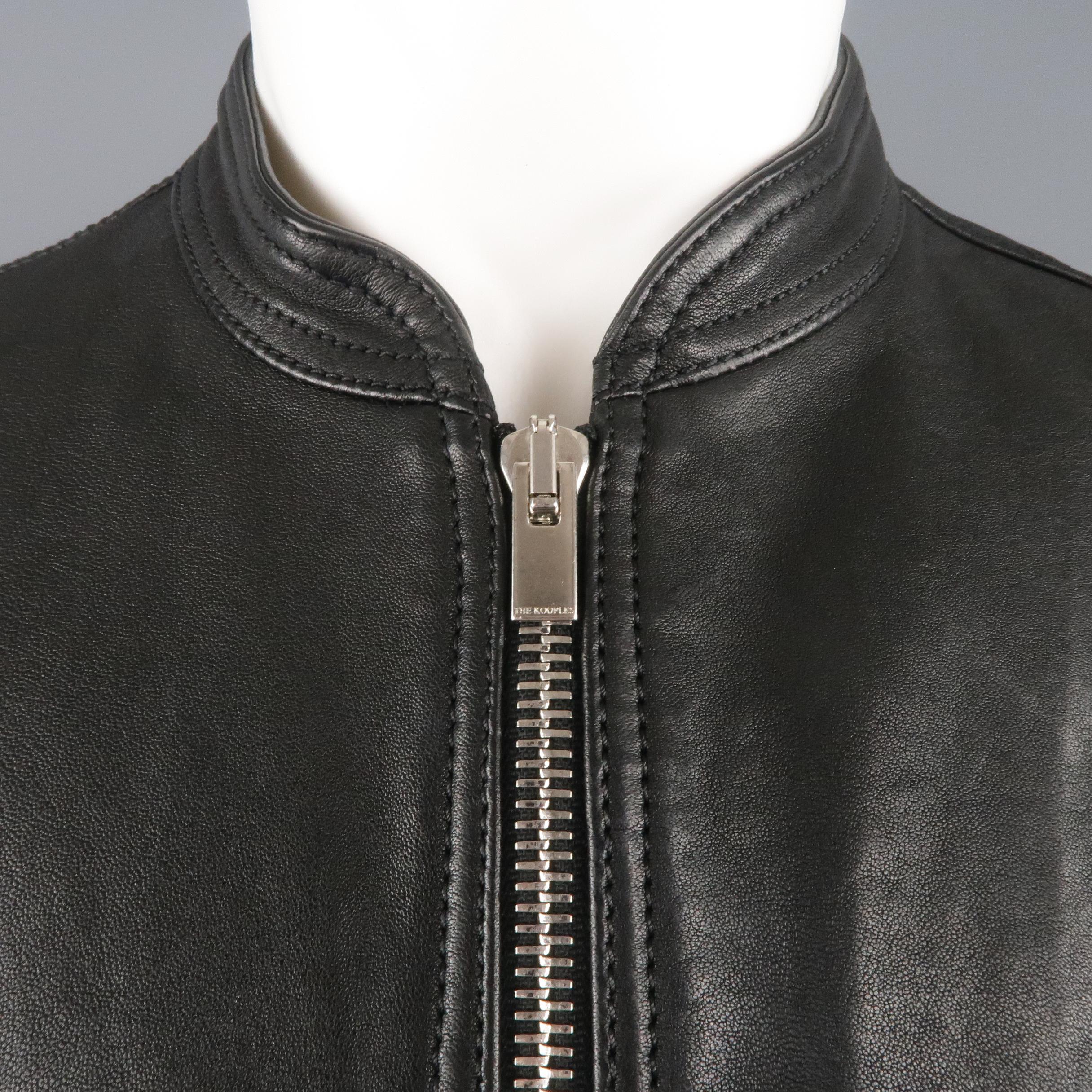 THE KOOPLES biker style jacket comes in black leather with a baseball collar, zip front, dual patch flap pockets, snap cuffs, and ribbed waistband.
 
Excellent Pre-Owned Condition.
Marked: M
 
Measurements:
 
Shoulder: 16.5 in.
Chest: 40 in.
Sleeve: