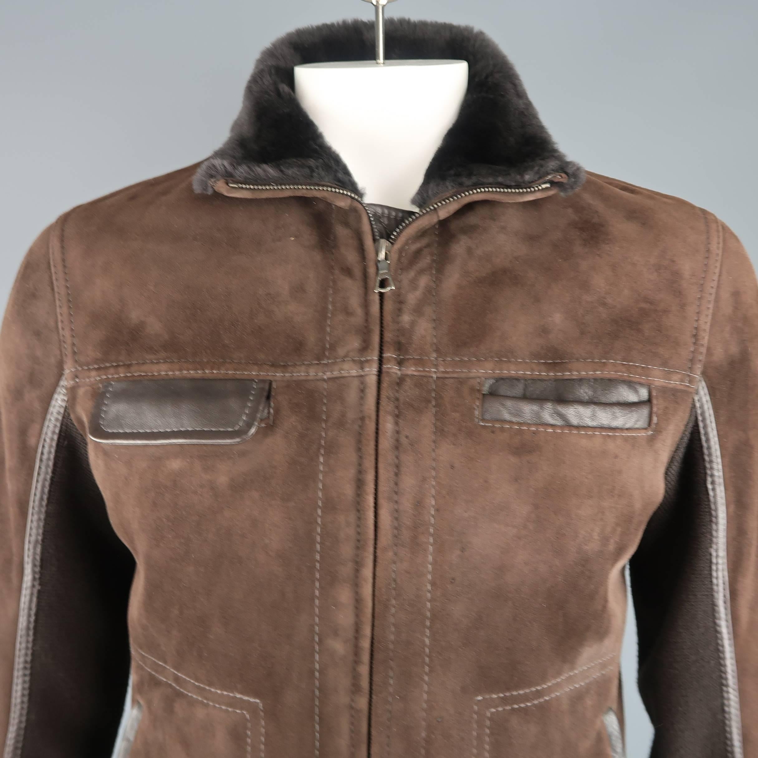 THEORY jacket comes in brown suede shearling with fur interior and features a zip front, leather trimmed pockets, and knit panel sleeves. Spots on front. As-is.
 
Good Pre-Owned Condition.
Marked: L
 
Measurements:
 
Shoulder: 18 in.
Chest: 40