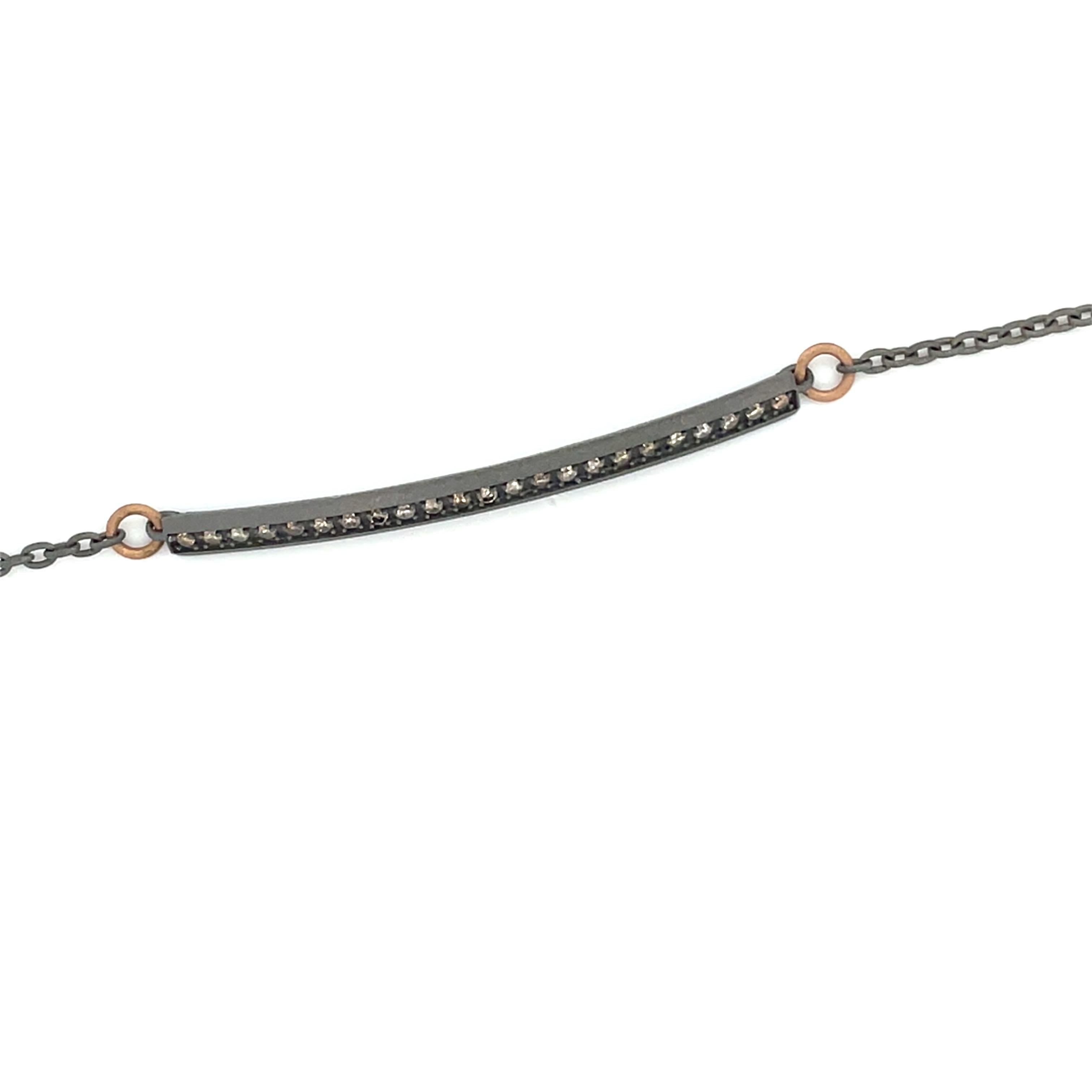 Titanium stylish bracelet is from our Heroes Collection. This modern bracelet is decorated with 12 natural brown round diamonds in total of 0.23 Carat with 18K rose gold details. The bracelet is 20cm long. Sensitive design and perfect to 