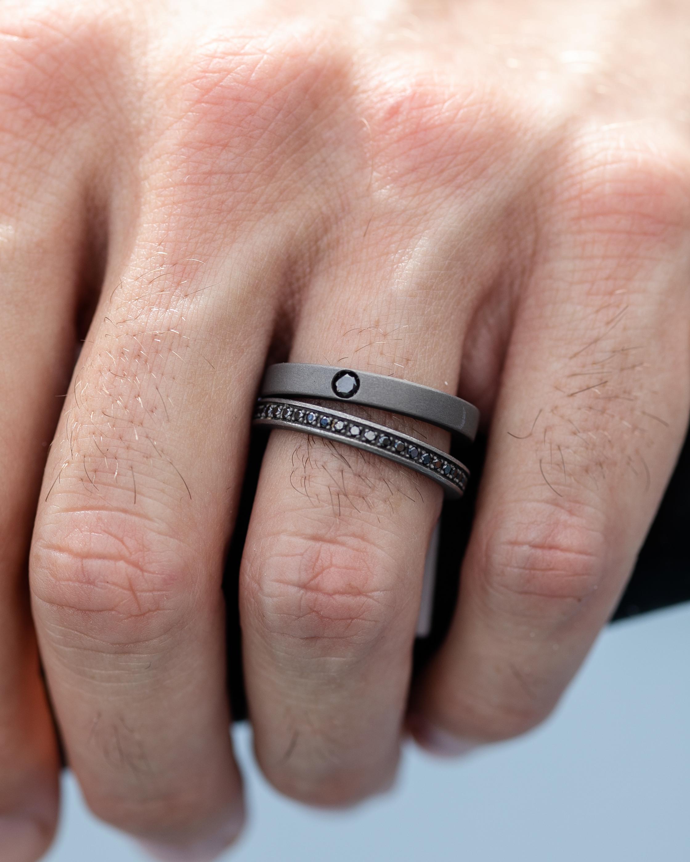 Titanium band ring is from our Men's Collection. This masculine ring is decorated by round black diamond in total of 0.1 Carat The band is 0.3cm wide. Perfect for masculine look!

The men’s collection is a collection of jewelry inspired by the world