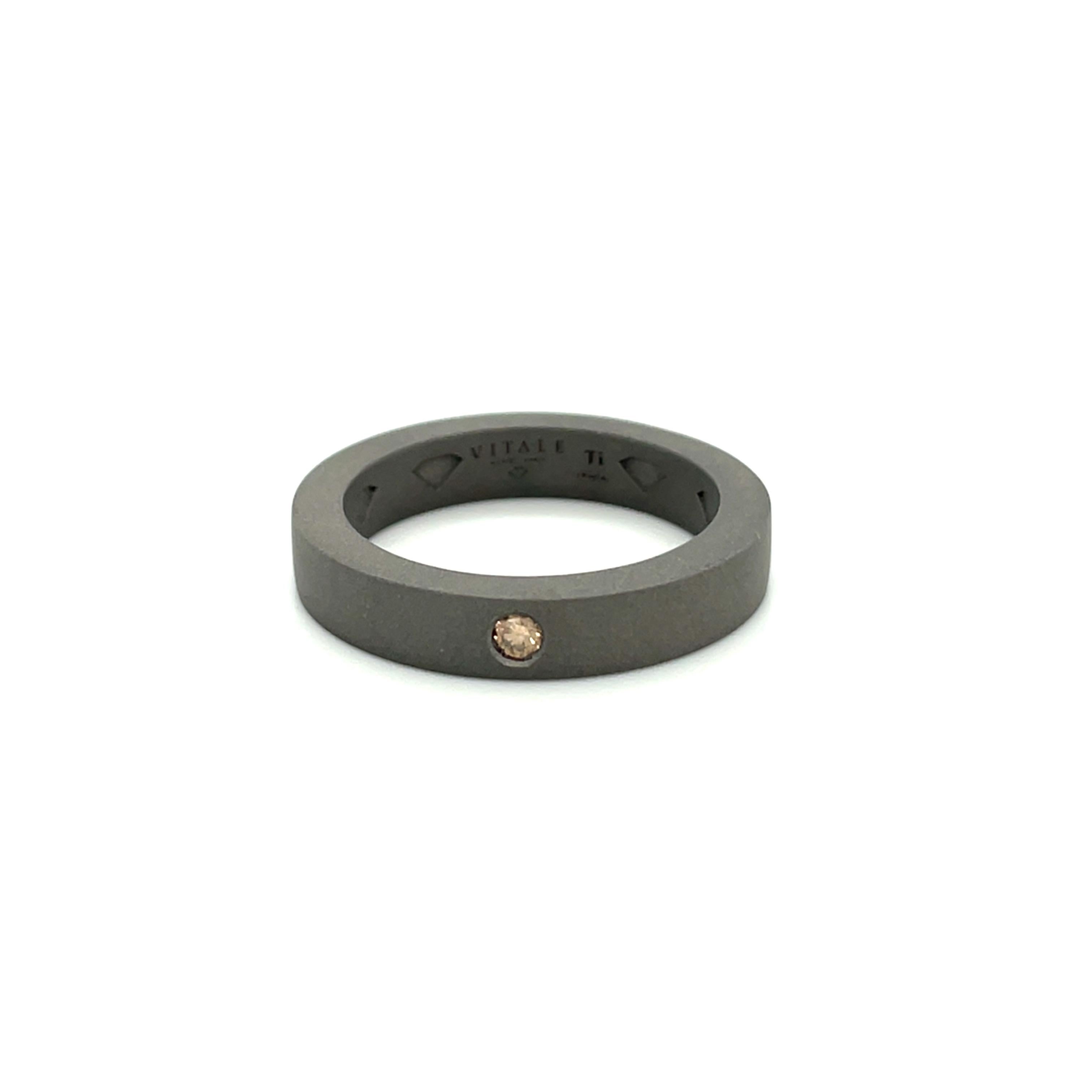 Titanium band ring is from our Heroes Collection. This masculine ring is decorated by round brown diamond in total of 0.05 Carat. The ring size is 60mm/9 US size and it is not resizable. Perfect for stylish look!

The men’s collection is a