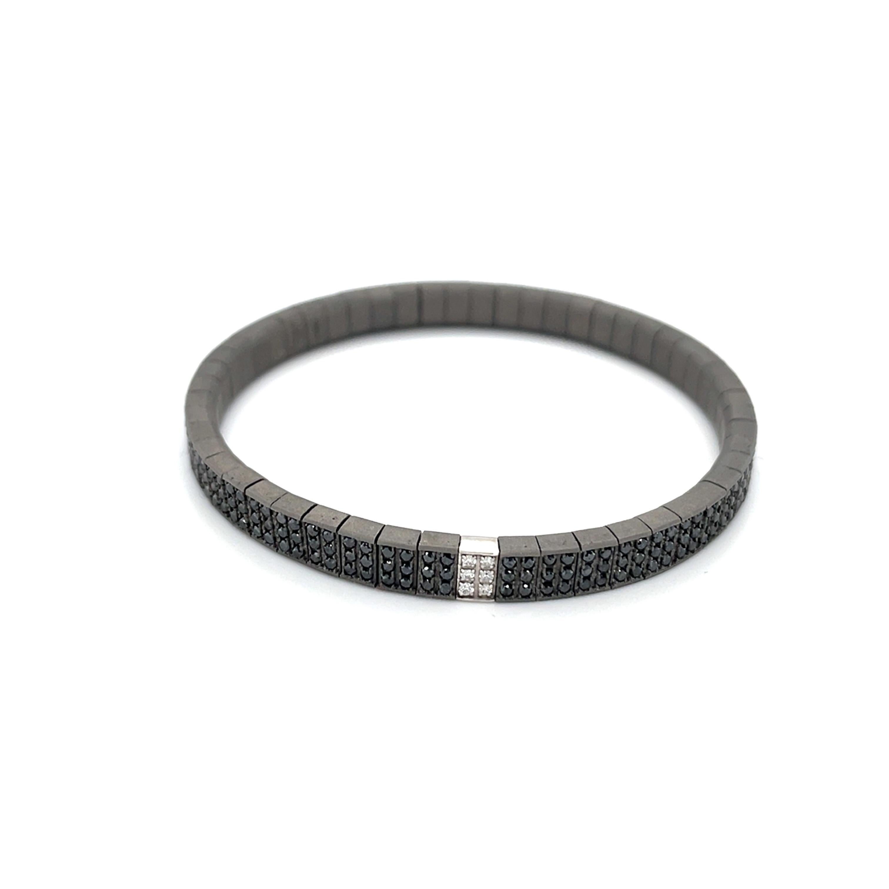 18K white gold bracelet is from our Men’s Collection. This masculine flexible bracelet is made of natural round black diamonds in total of 3.12 Carat placed along the bracelet with 6 natural round colorless diamonds in total of 0.06 Carat placed on