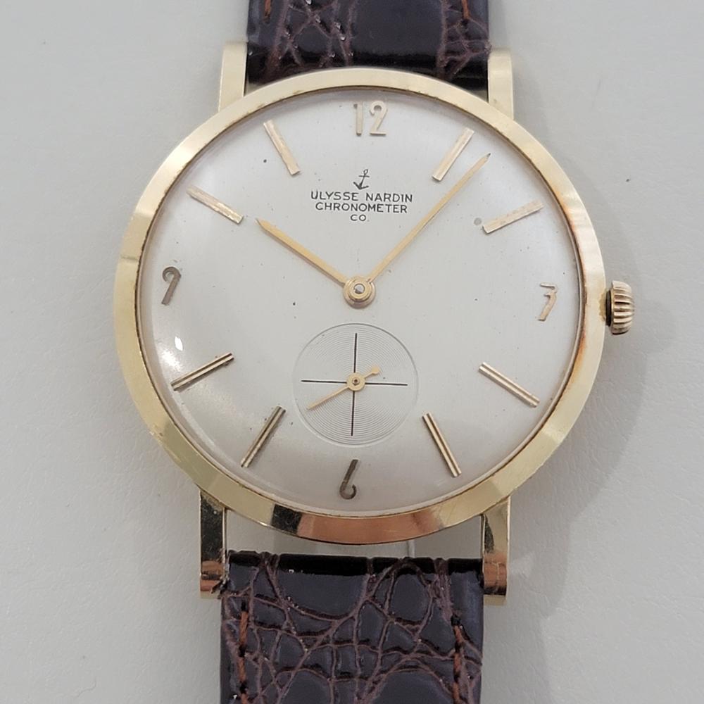 Vintage classic, Men's Ulysse Nardin 14k solid gold slim manual wind dress watch, c.1960s, in excellent working condition. Verified authentic by a master watchmaker. Gorgeous Ulysse Nardin signed dial, applied baton and Arabic numeral 3, 6,9, 12