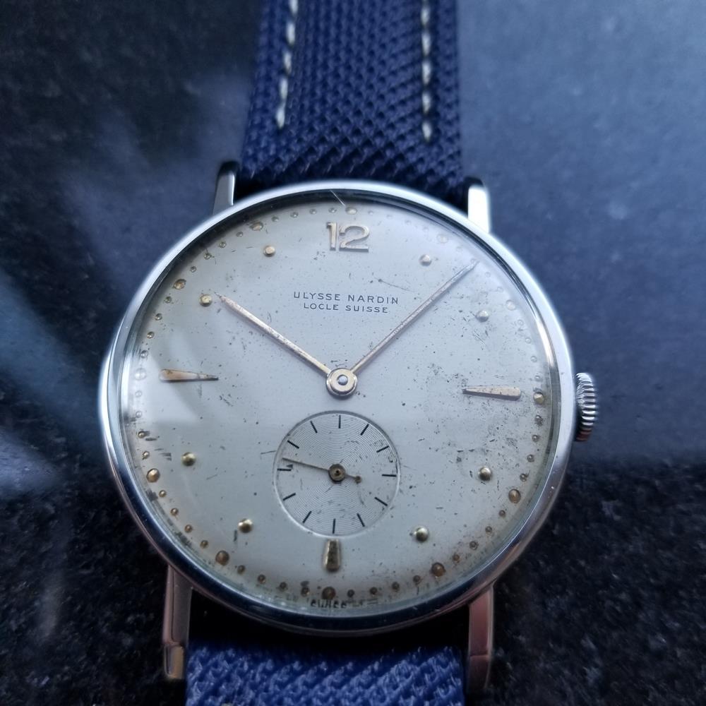 Vintage classic, men's Ulysse Nardin manual hand-wind field watch, c.1950s. Verified authentic by a master watchmaker. Gorgeous tanned Ulysse Nardin silver dial dial, applied gold dagger and droplet hour markers, Arabic numeral 12, gold minute and