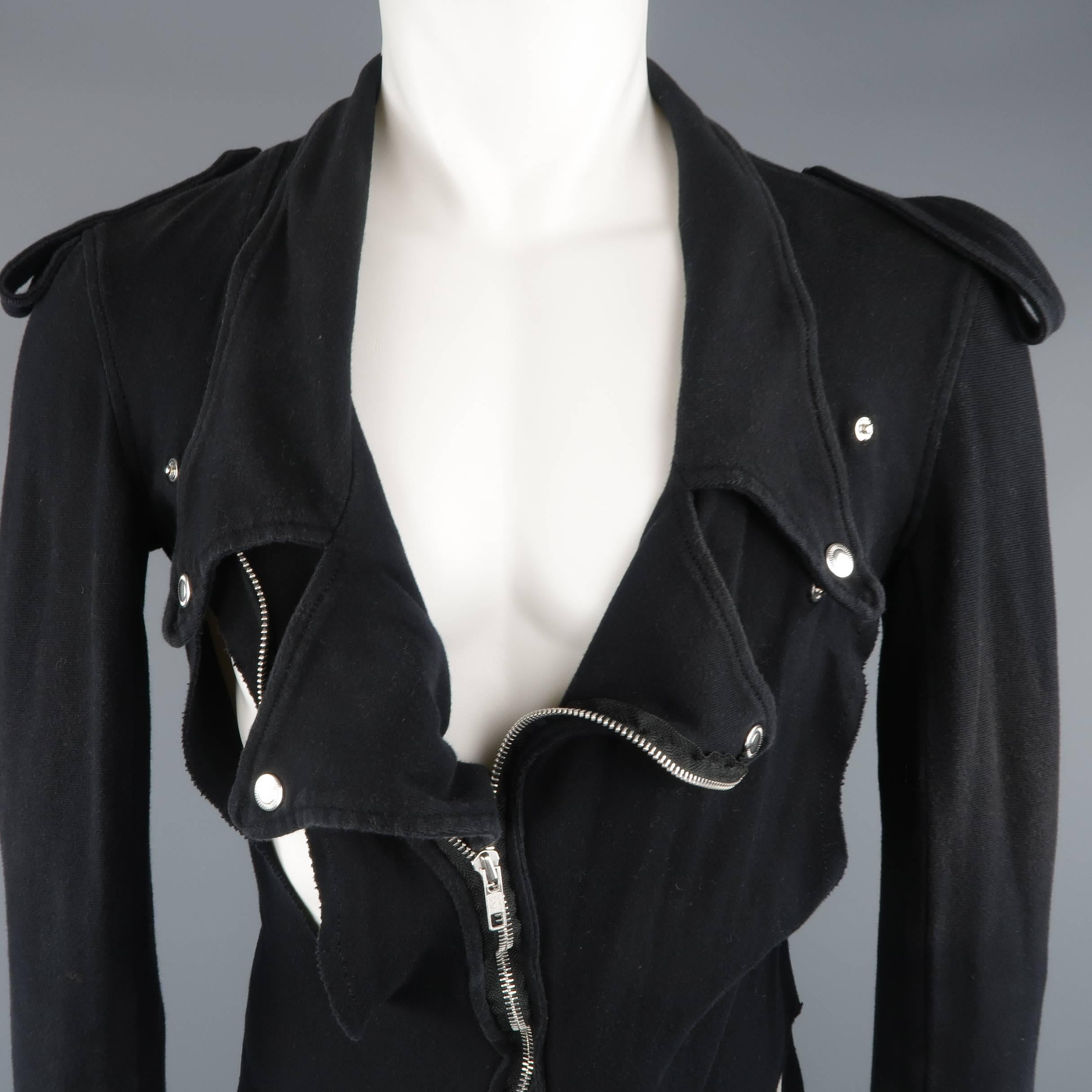 UNDERCOVER avant garde biker jacket comes in black cotton twill and features a pinted lapel with snaps, asymmetrical zip closure, epaulets, shredded cutouts, and bondage strap sides. Wear throughout. As-is. Made in Japan.
 
Fair Pre-Owned