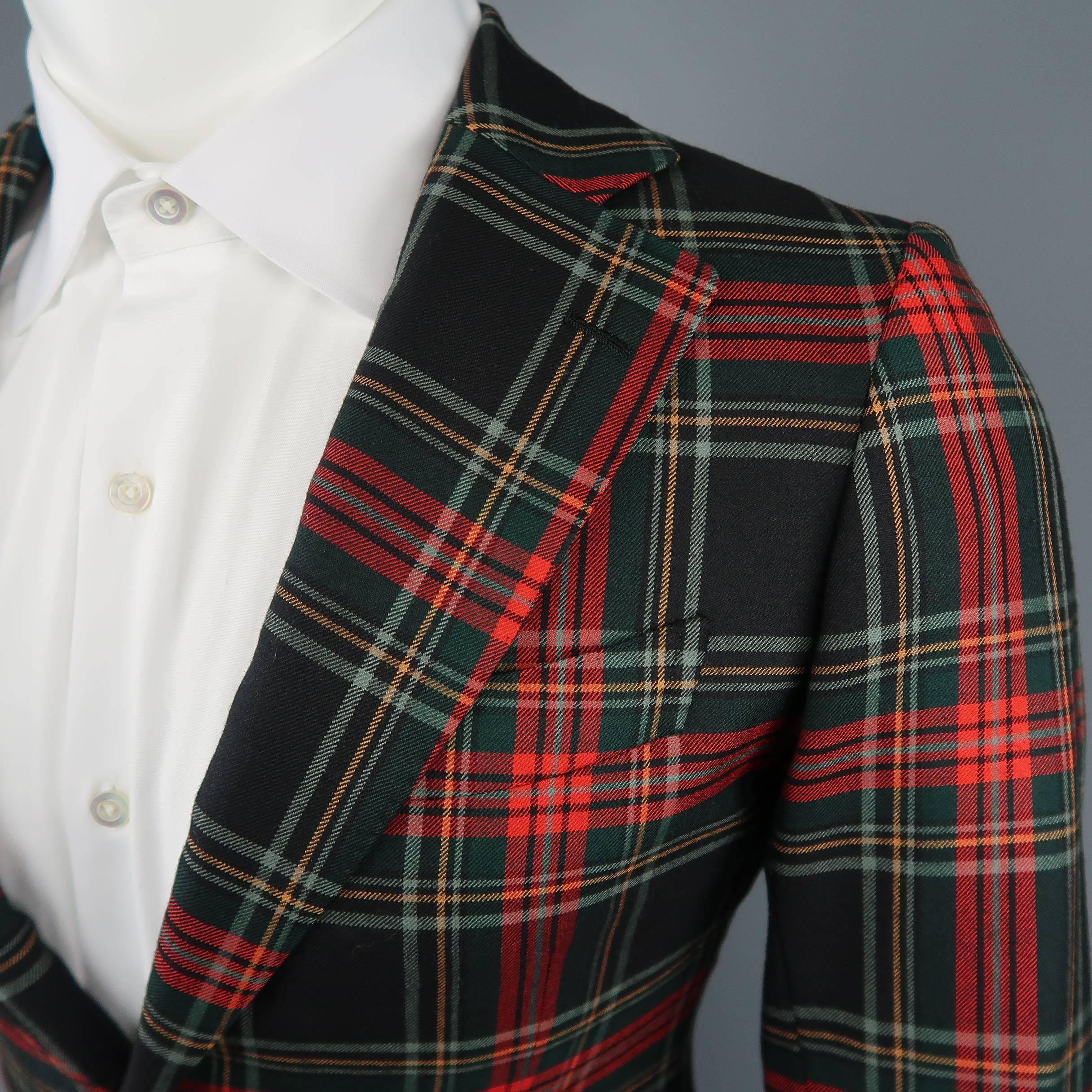 Single breasted UNITED ARROWS sport coat comes in red and black tartan plaid wool twill with a notch lapel, single vented back and two button closure with gold tone metal buttons. Made in Japan.
 
Excellent Pre-Owned Condition.
Marked: 