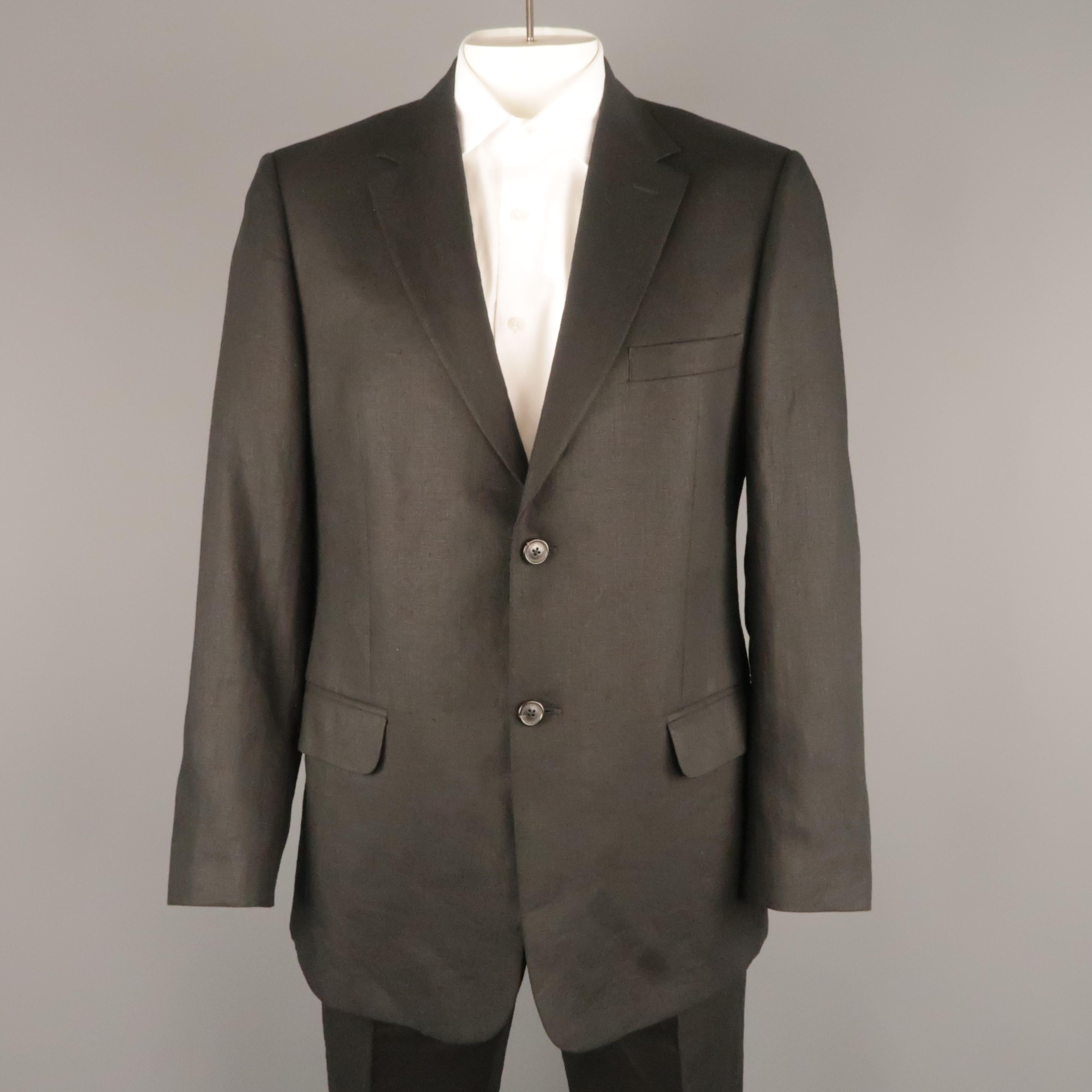 VALENTINO suit comes in black linen and includes a single breasted, two button sport coat with notch lapel and matching flat front trousers. Made in Italy.
 
Very Good Pre-Owned Condition.
Marked: (no size)
 
Measurements:
 
-Jacket
Shoulder: 19
