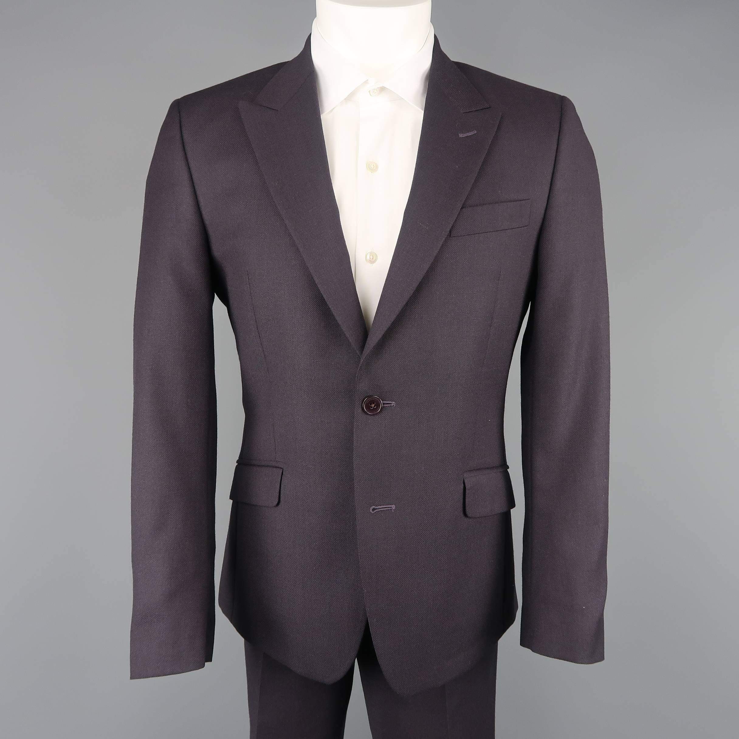 VERSACE COLLECTION two piece suit comes in an eggplant purple textured wool and includes a single breasted, two button sport coat with peak lapel, and matching fat front trousers.  Made in Romania.
 
Excellent Pre-Owned Condition.
Marked: IT 48
