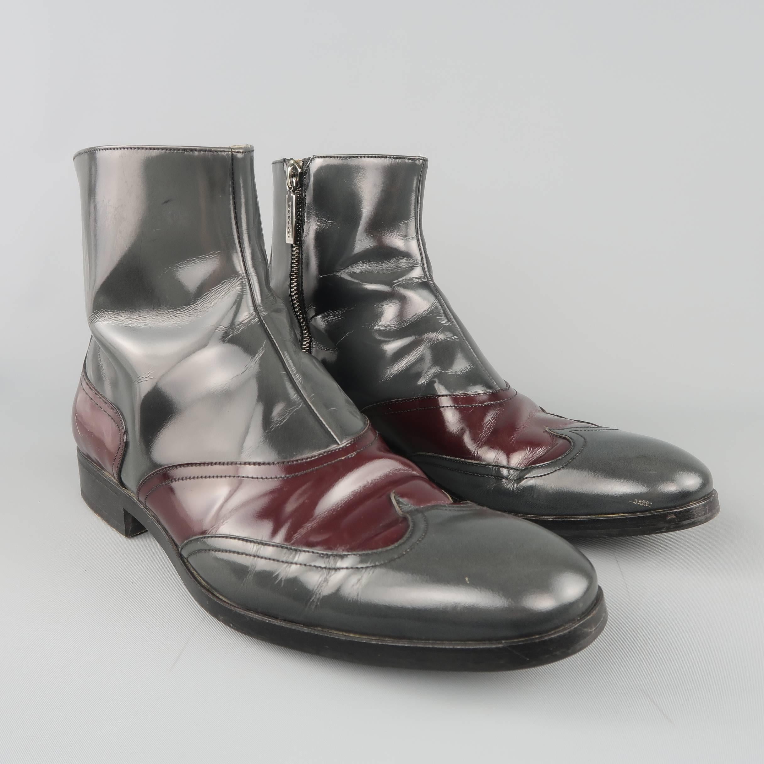 Archive VERSACE ankle boots come in dark gray patent leather with burgundy panels and a wingtip toe. Wear throughout. As-is. Made in Italy.
 
Fair Pre-Owned Condition.
Marked: IT 41
 
Outsole: 11.85 x 3.85 in.
Length: 6 in.
