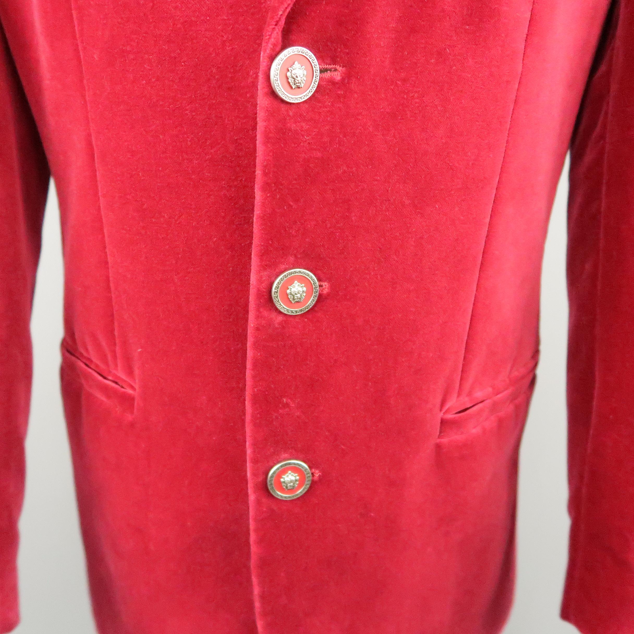 Vintage VERSUS by GIANNI VERSACE sport coat comes in raspberry red velvet with a notch lapel, three lion head button single breasted front, and ventless back. Made in Italy.
 
Very Good Pre-Owned Condition.
Marked: IT 34/48
 
Measurements:
