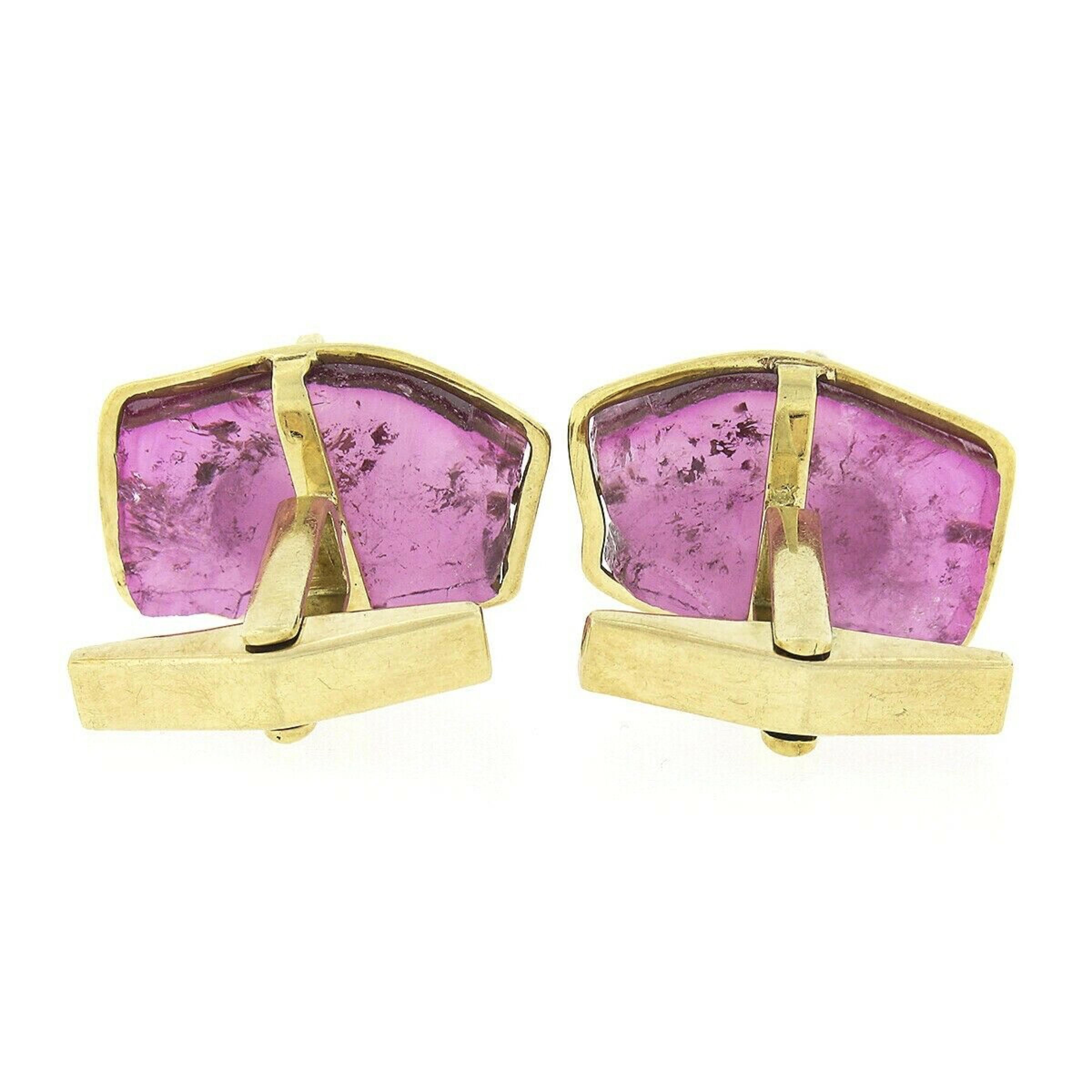 Here we have a very unique pair of vintage cuff links crafted from solid 18k yellow gold. The cuff links each feature a large pink tourmaline gemstone that have a polished portrait cut with natural sides. These gorgeous stones are well matched with