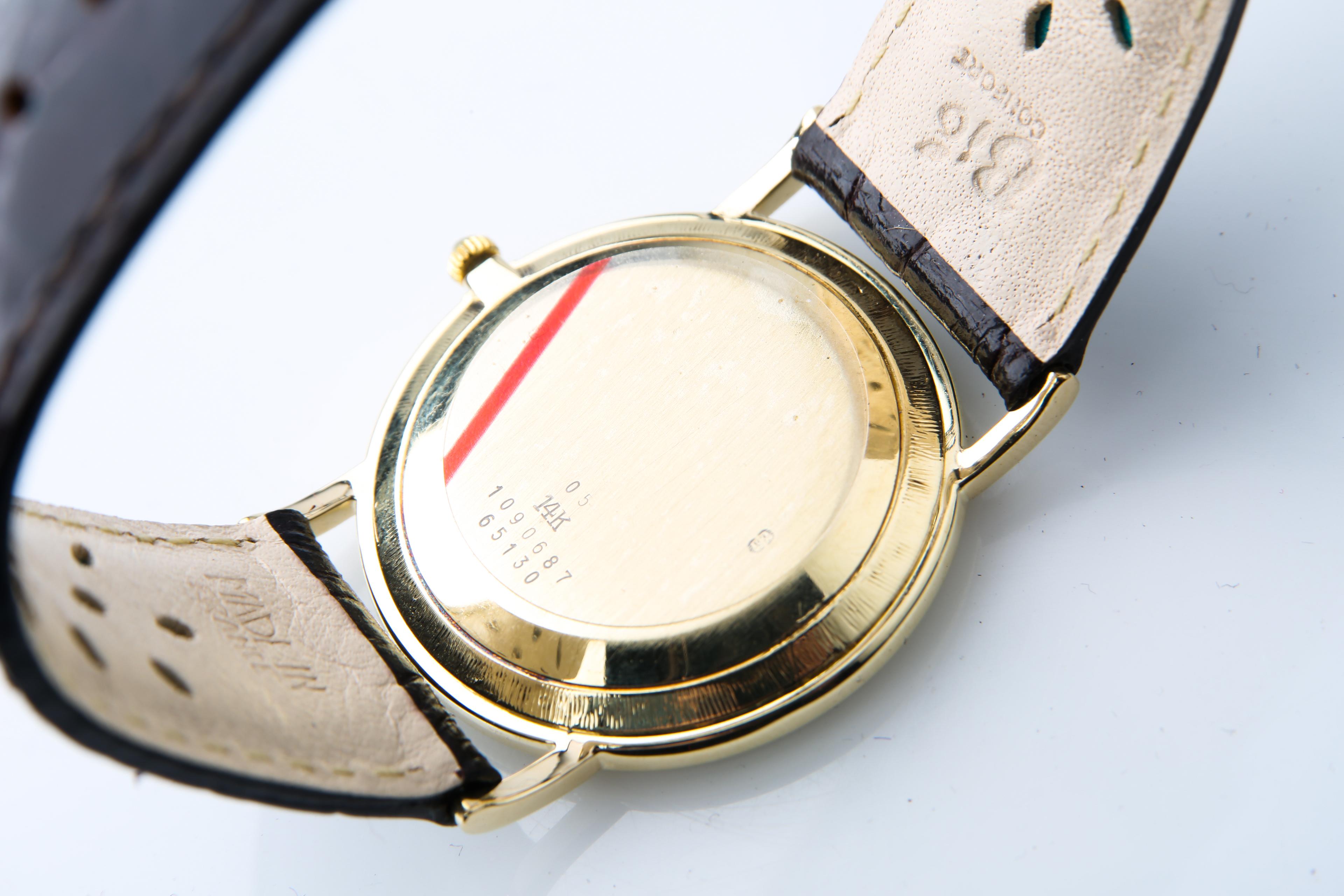 Modern Men's Vintage Φ Baume & Mercier 14k Yellow Gold Quartz Watch Black Leather Band For Sale