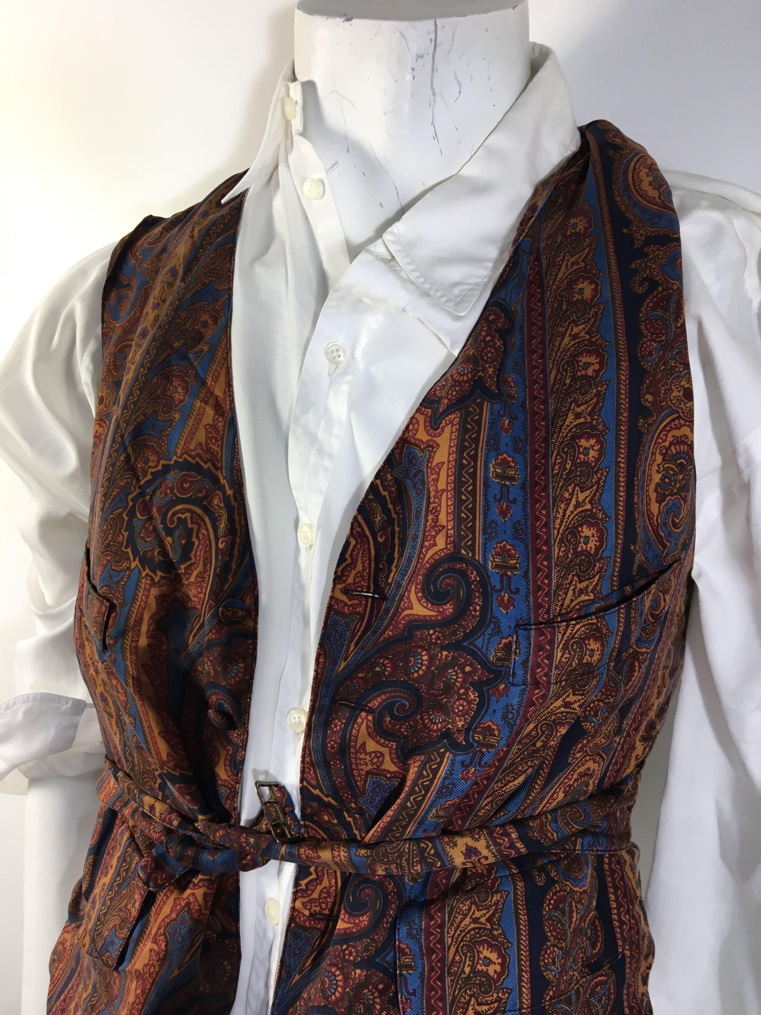 Mens Vintage Hermes Paris Exclusive
100% Silk Brown-Multi Paisley Print Vest
5 Button with Tie at Waist
Chest and Waist Pockets
Size 48
Made in France