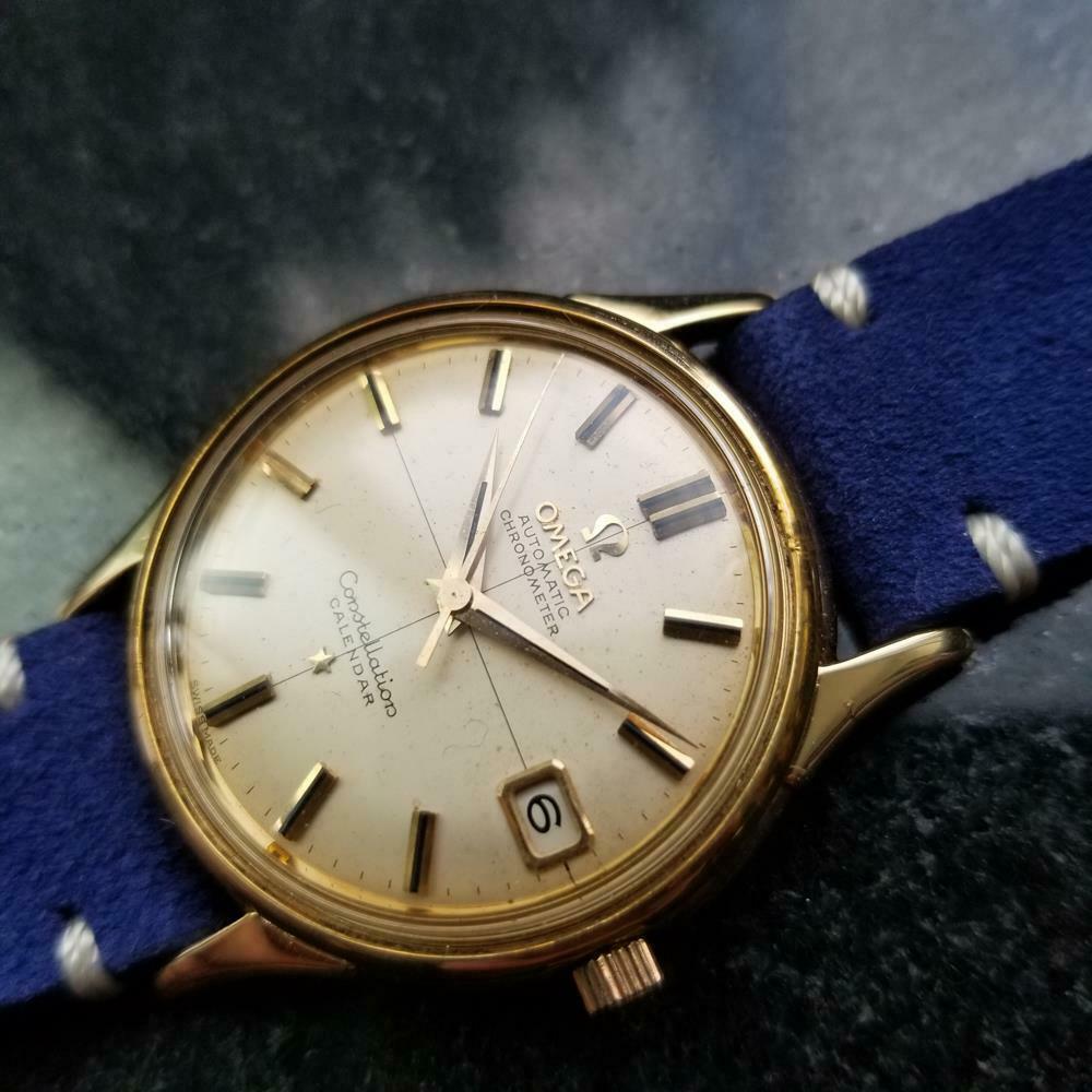 Luxurious vintage classic, men's 18K solid gold Omega Constellation Calendar ref.14393 automatic, c.1960. Verified authentic by a master watchmaker. Gorgeous, vintage gold Omega signed dial, applied gold indice hour markers, gold minute and hour