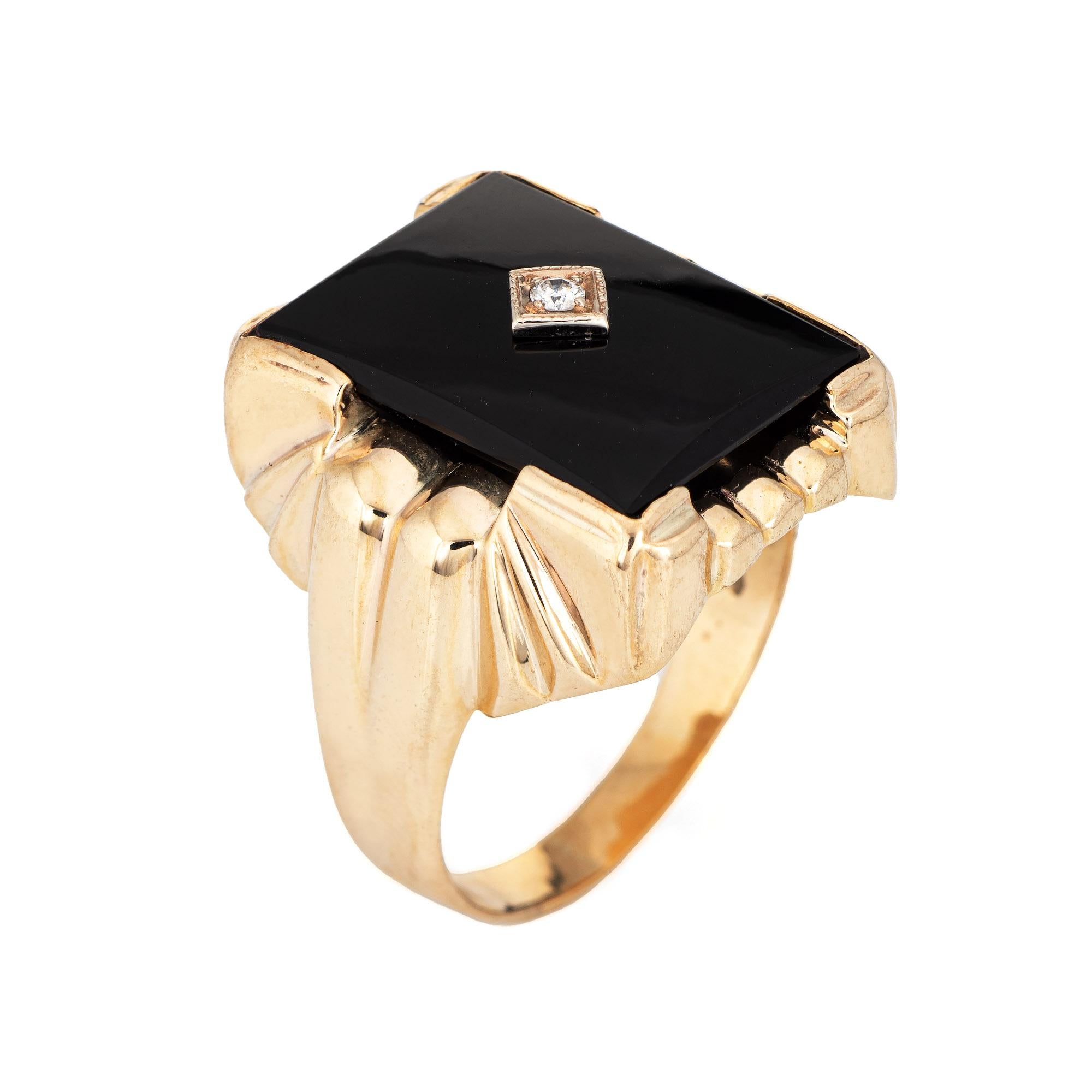 Stylish vintage onyx & diamond ring (circa 1960s to 1970s) crafted in 10 karat yellow gold. 

Black onyx measures 20mm x 15mm (in very good condition and free of cracks or chips). The diamond is estimated at 0.04 carats (estimated at I-J color and