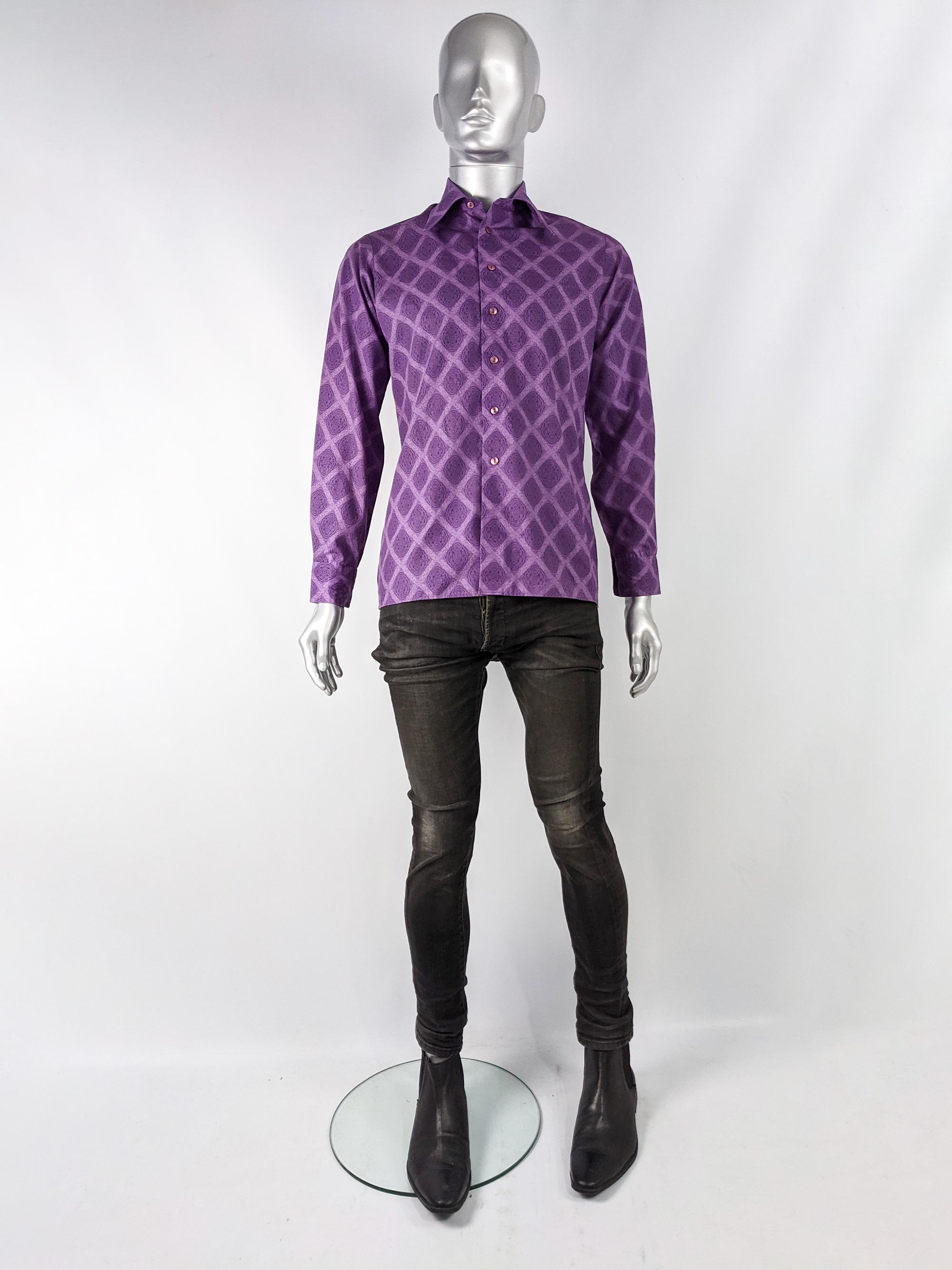 An excellent and rare vintage men's shirt from the 1970s by luxury British label Hornes of London. It is made from a purple poly cotton fabric with an amazing mod style arabesque print throughout. It has long sleeves, a slim fit and a typical 1970s