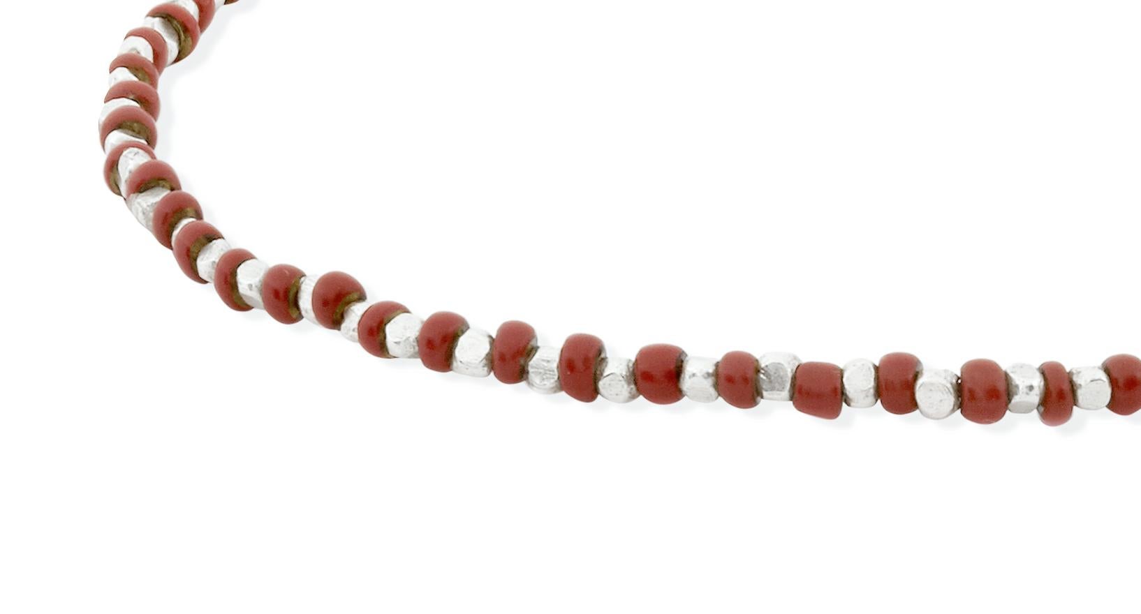 This bracelet features antique rust coloured Venetian glass trade beads, accented with alternating fine silver beads.  Strung on strong, stretchy elastic.

These antique Venetian trade beads were produced in the early 1900s primarily for the palm