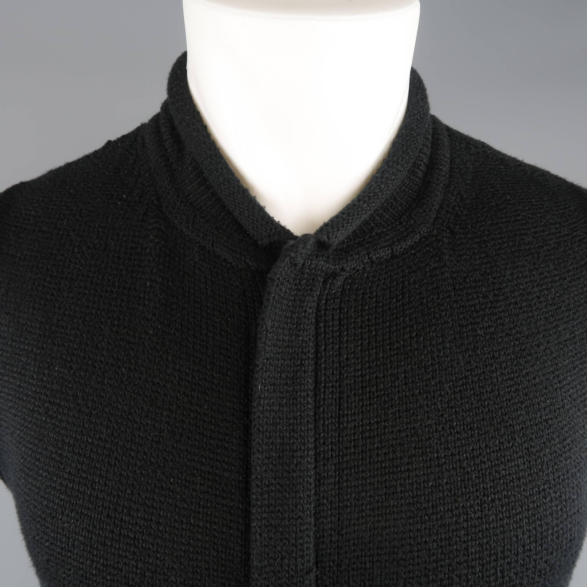 Vintage YOHJI YAMAMOTO POUR HOMME vest comes in a cotton blend knit with raw edge trim, baseball collar, hidden placket zip closure with contrast stitching, and slanted pockets. Wear throughout. As-is. Made in Japan.
 
Fair Pre-Owned