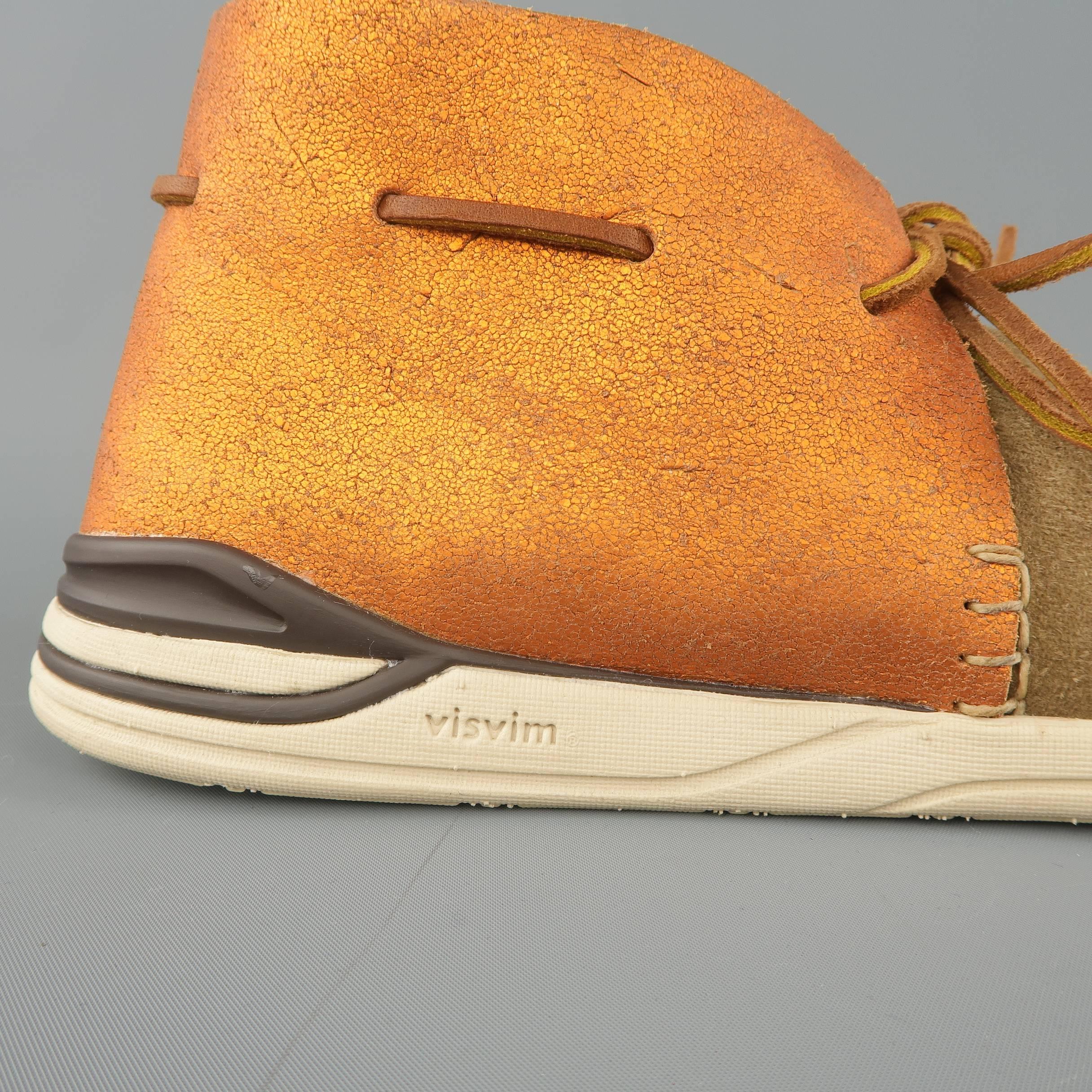 VISVIM sneaker boots come in light taupe mock folk suede with perforated sides, beige rubber sole, and metallic orange panel with woven tie. Made in Japan.
 
New with Box.
Marked: US 9.5
 
Outsole: 11.5 x 4 in.