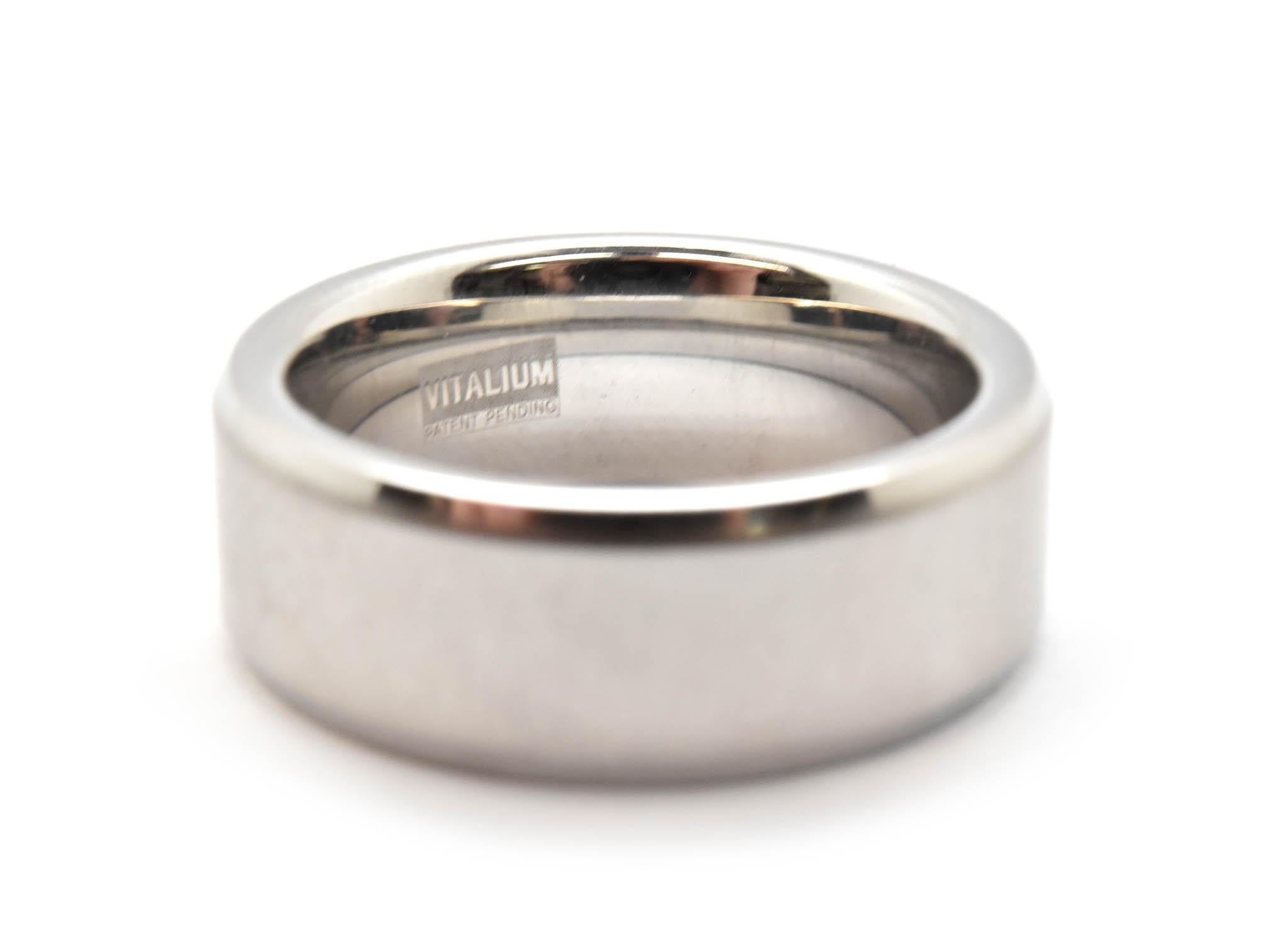 This men’s wedding band is crafted in Vitalium with satin center. It measures 8mm wide and it is a size 8. 