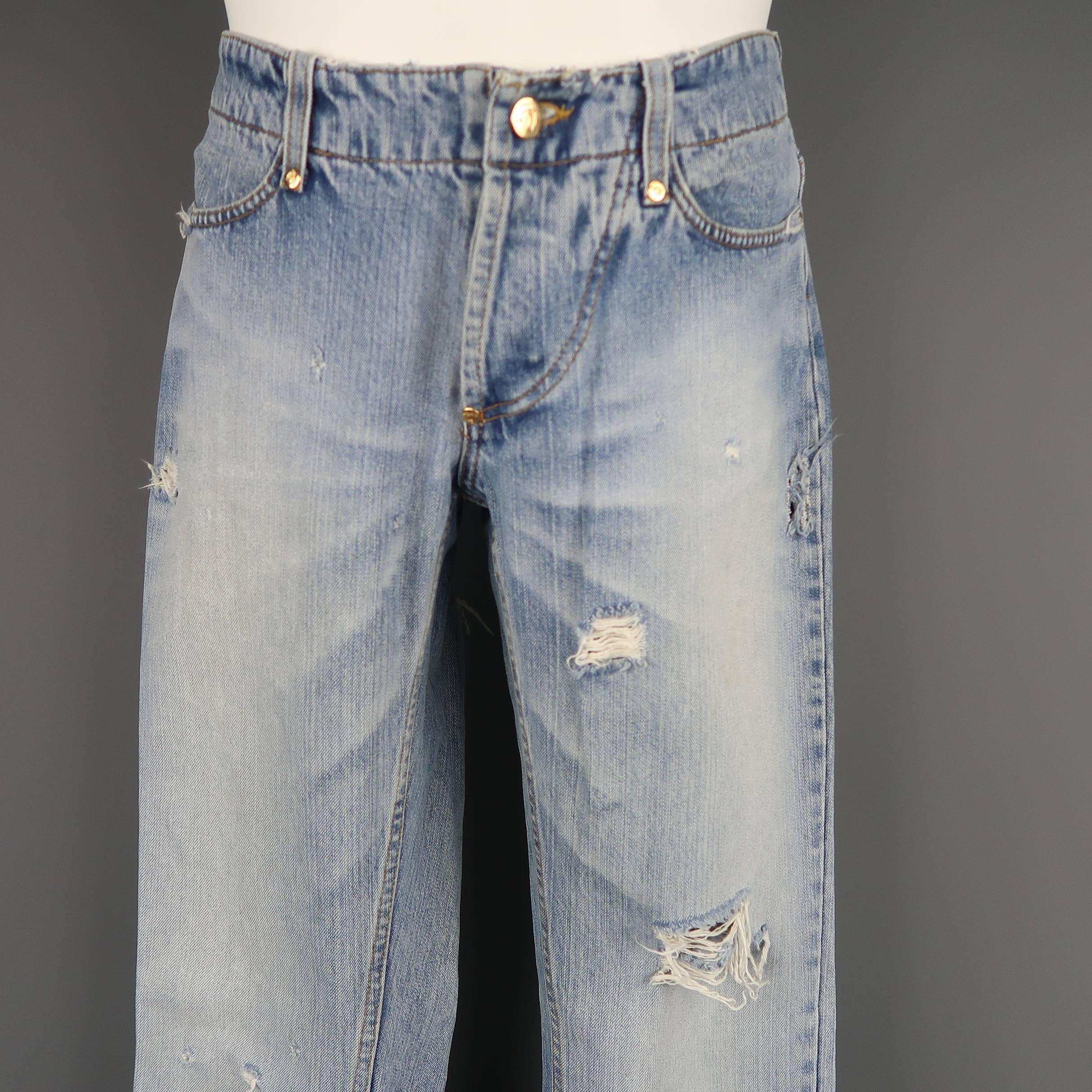 ANGLOMANIA by VIVIENNE WESTWOOD jeans come in a light washed denim with gold tone engraved hardware, a slightly flaired leg, and distressed details throughout. Made in Italy.
 
Good Pre-Owned Condition.
Marked: 32
 
Measurements:
 
Waist: 32