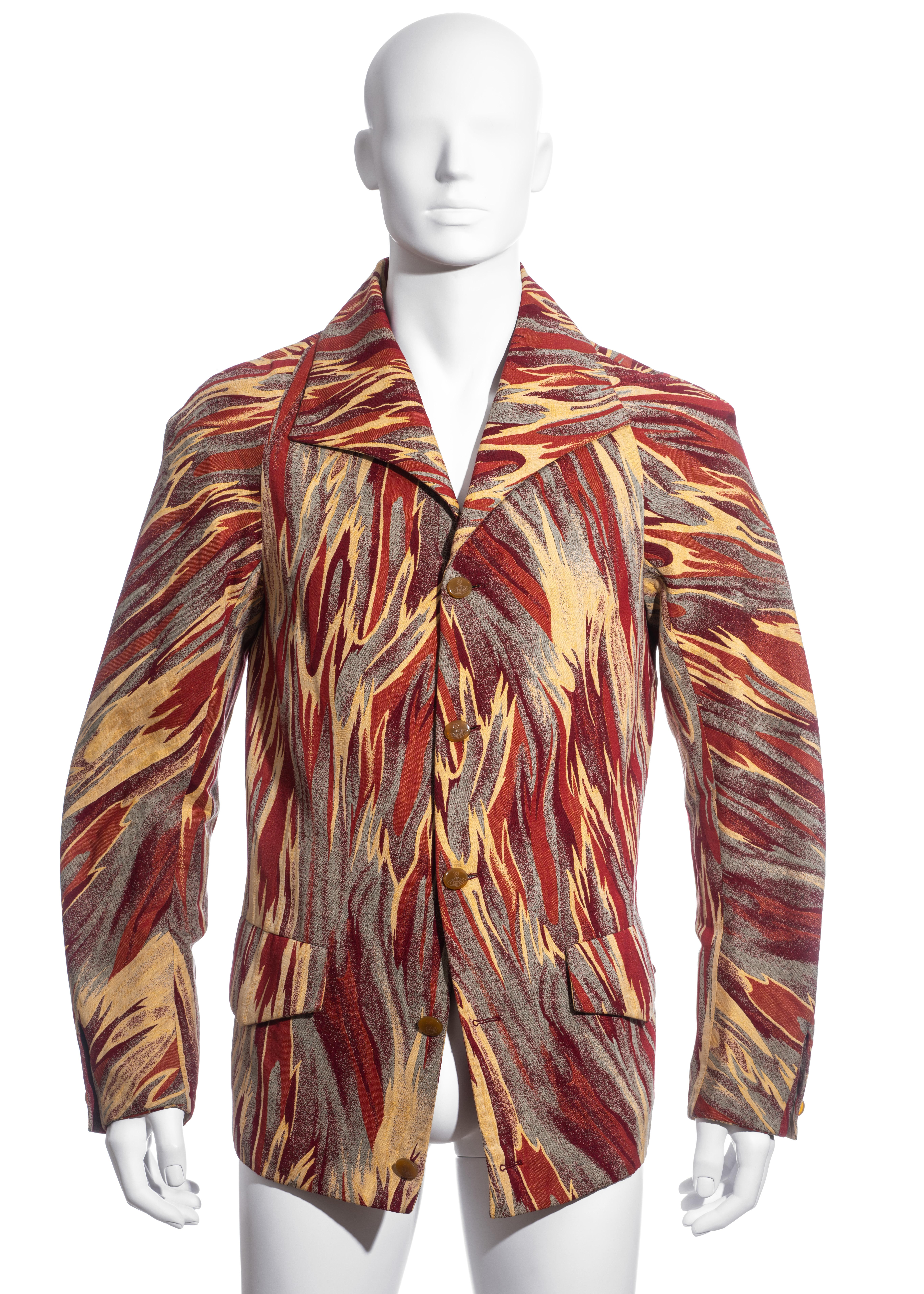 ▪ Men's Vivienne Westwood button-up jacket
▪ Cotton jacquard in a fire patterned design
▪ Curved Raglan sleeves 
▪ Cotton lining 
▪ Size 50
▪ Fall-Winter 1997