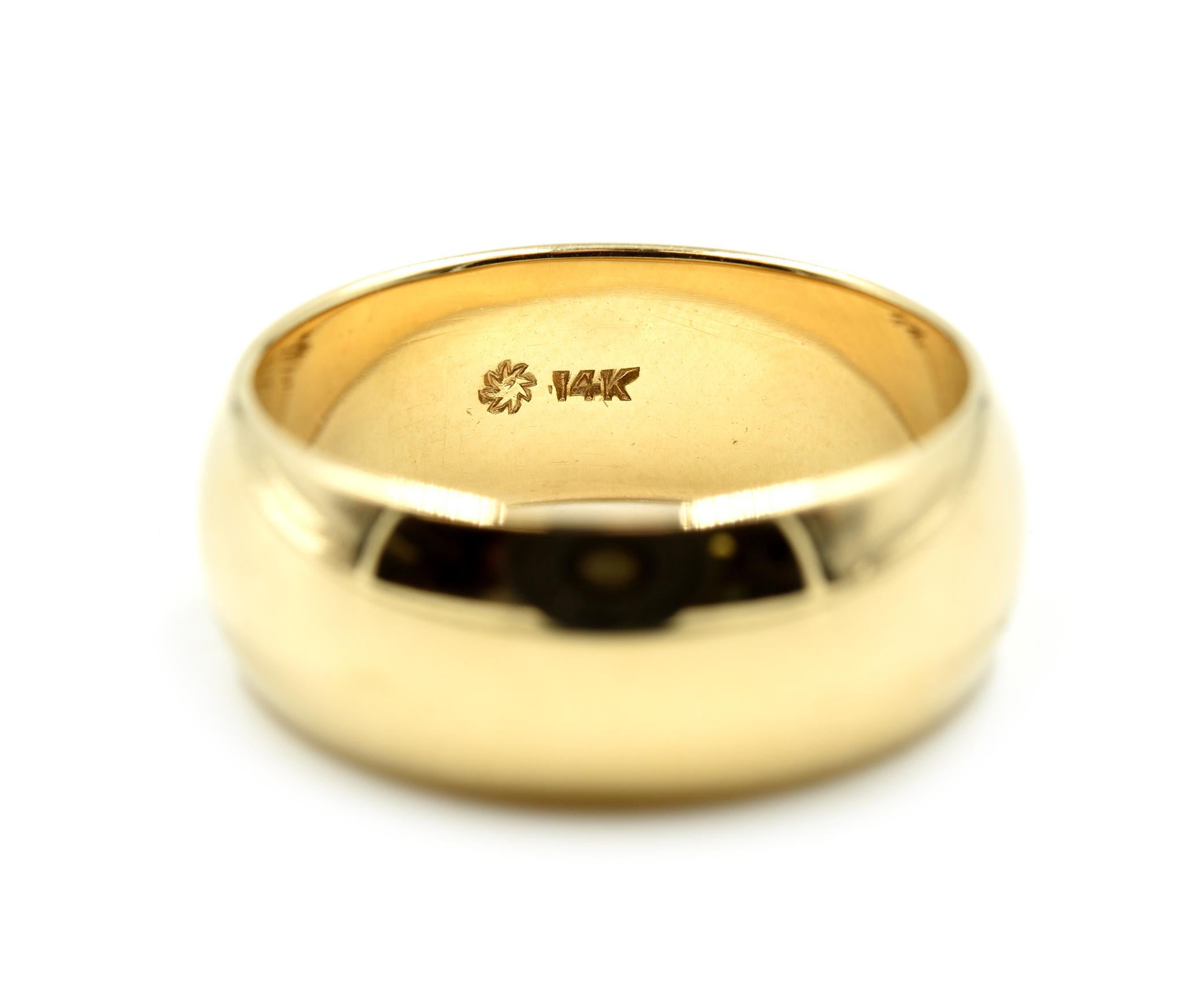 Designer: custom design
Material: 14k yellow gold
Dimensions: band is 8mm long
Ring size: 8 ¾ 
Weight: 9.30 grams
