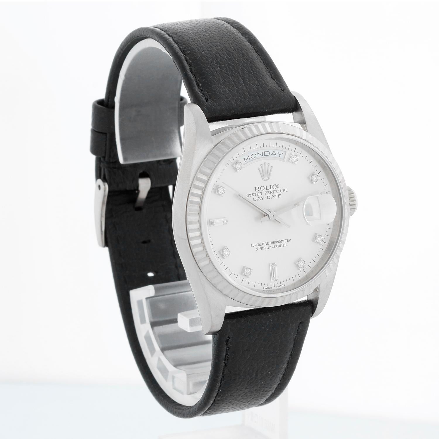 Men's  White Gold Rolex President Day-Date Watch 18239 - Automatic winding, 31 jewels, double Quickset, sapphire crystal. 18k white gold case and fluted bezel (36mm diameter). Factory Silver diamond dial. New Black Rolex band with 18K White gold