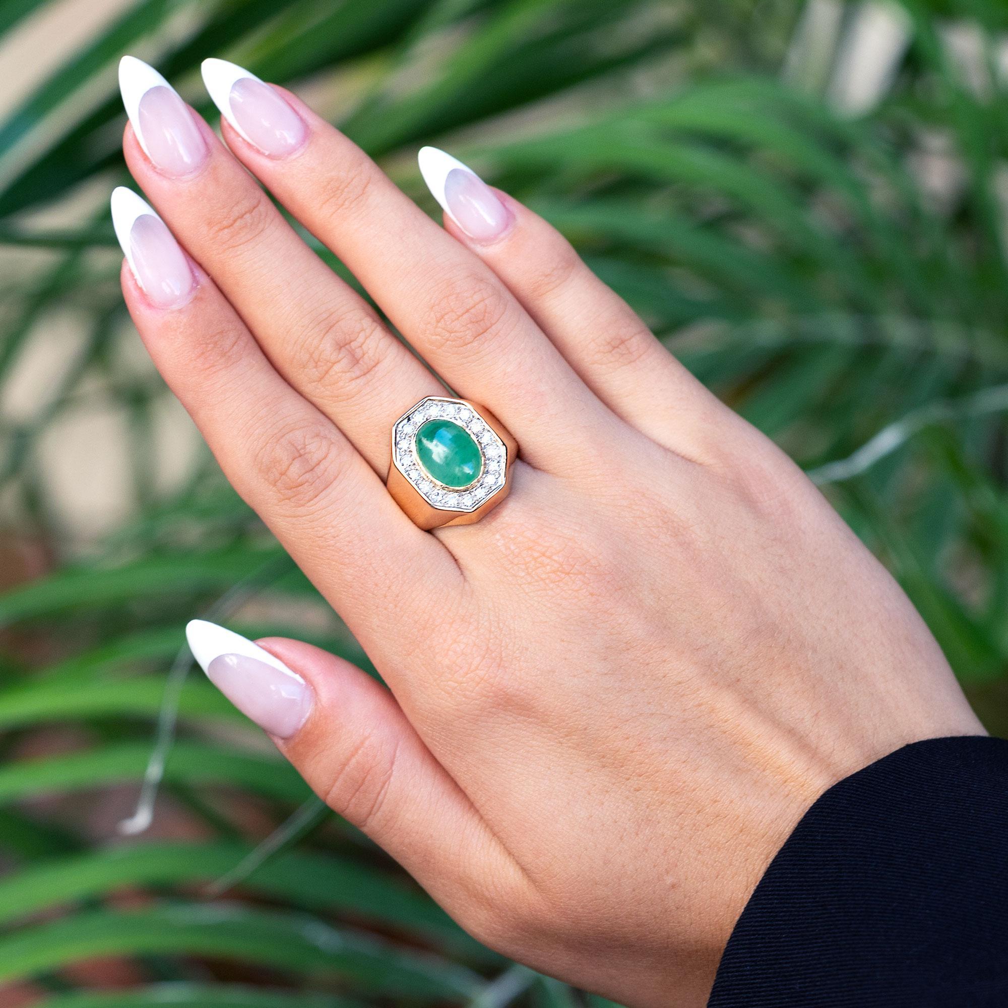 An embrace of the monumental Art Deco era, this vintage Mid Century jadeite cocktail ring glows with a lustrous, mottled apple green color and a significant architectural setting. The sultry natural jade cabochon begs to converse from it's smooth
