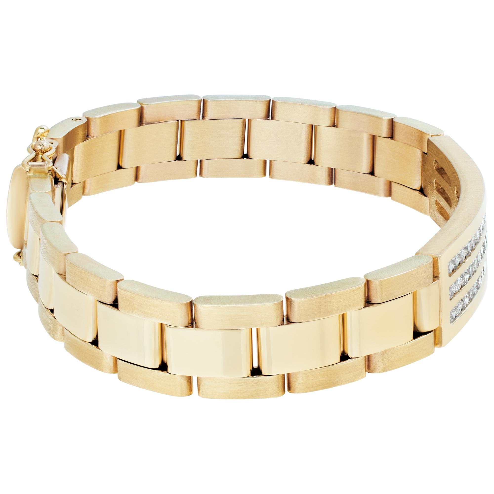 Mens Oyster link style diamond bracelet in 14k yellow gold. Approximately 2.55 carats in round channel set diamonds (H-I color, SI clarity). 8 inch length. 0.5 inch width.
