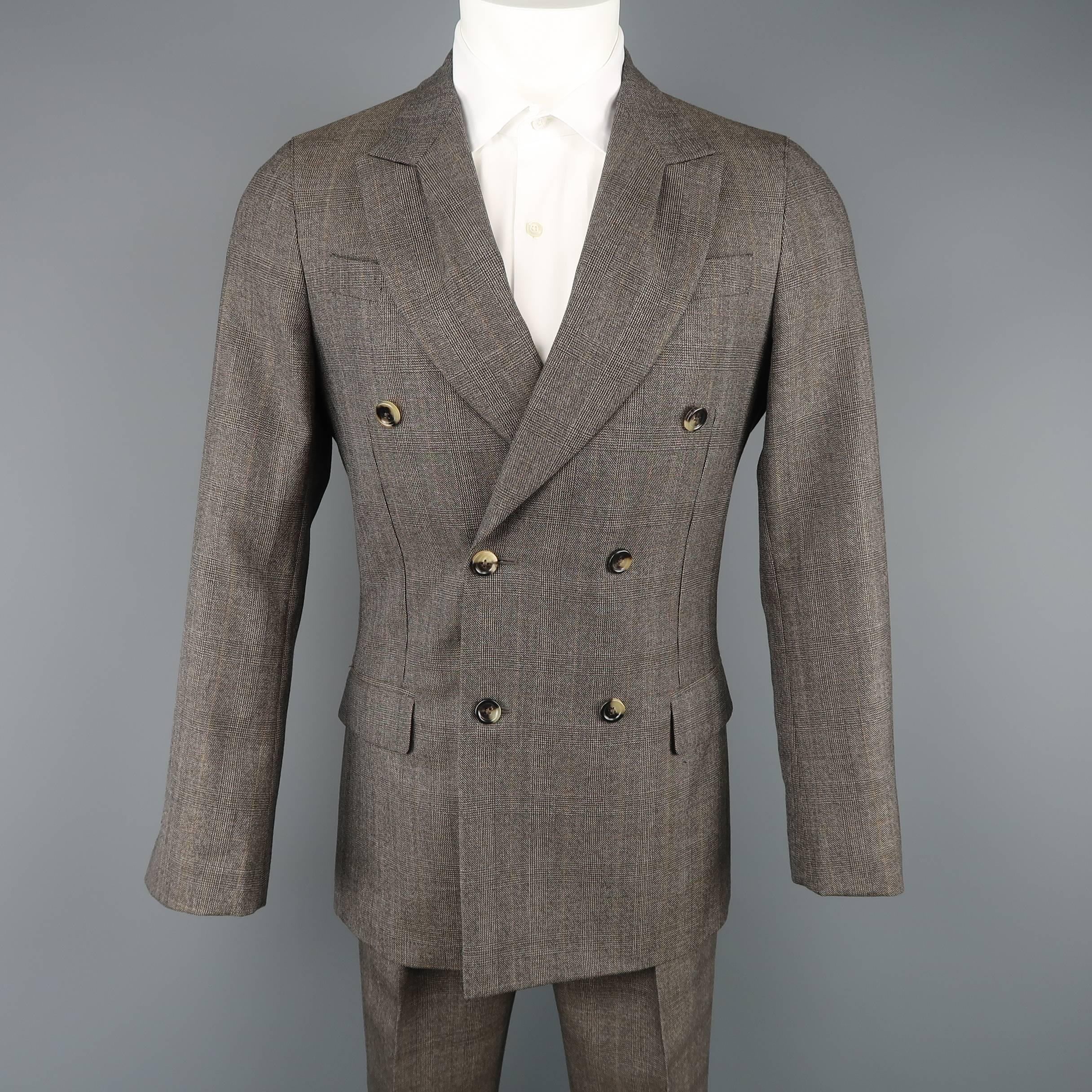 Two piece YVES SAINT LAURENT suit by TOM FORD comes in taupe Glenplaid wool and includes a double breasted sport coat with pleated peak lapel and tab cuffs,with matching single pleat trousers. Made in Italy.
 
Excellent Pre-Owned Condition.
Marked: