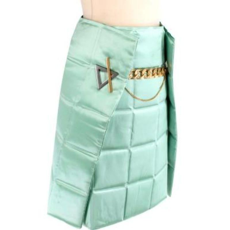 Bottega Veneta Menta Lacquered Matelasse Satin Skirt
 
 
 
 -Sophisticated matelassé quilted finish 
 
 -Asymmetrical wrap back
 
 -Two pieces 
 
 -Chain Belt fastening 
 
 -Gold tone hardware 
 
 -High waisted 
 
 -Fall 2019 
 
 
 
 Material: 
 
 
