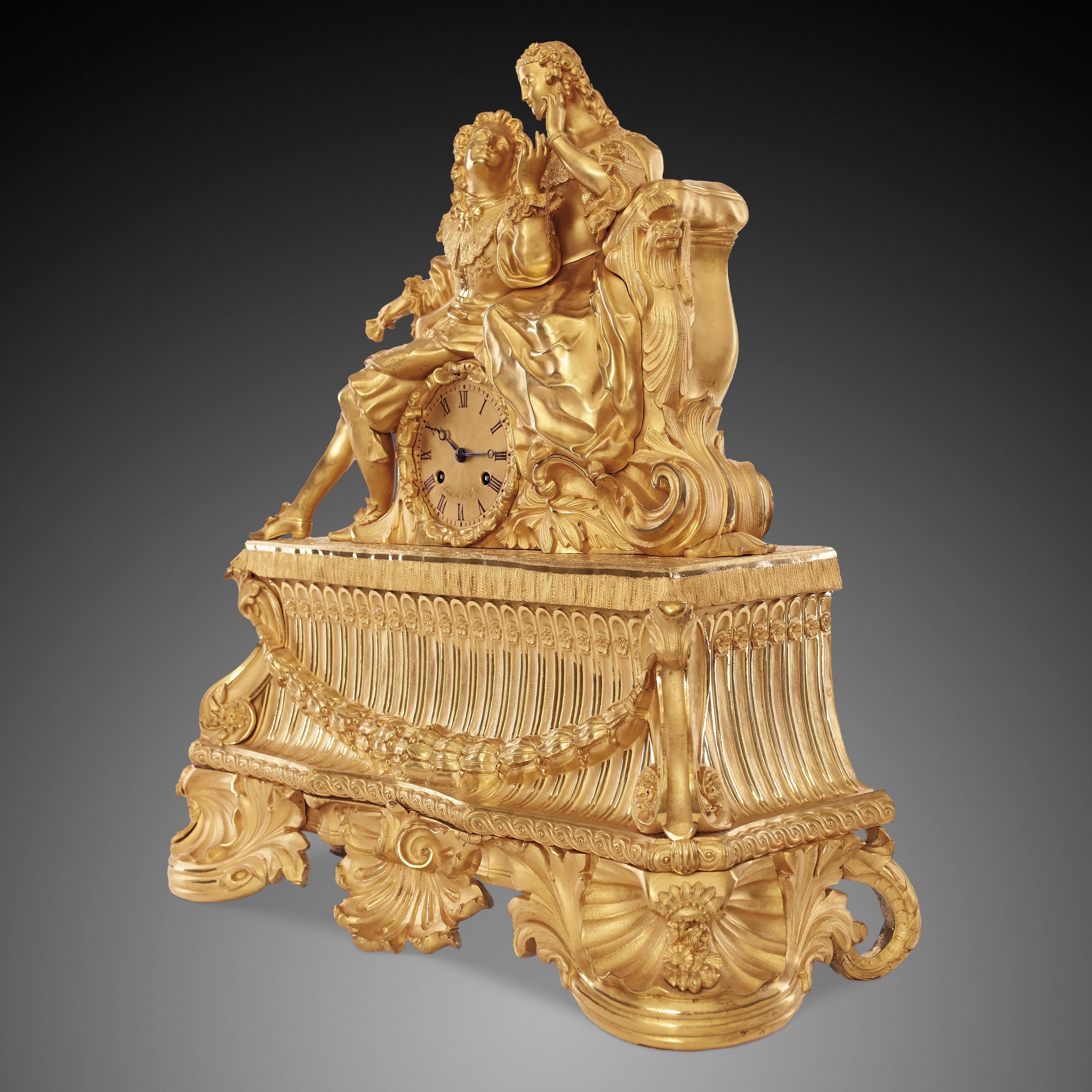 Antique French Louis Philippe style gilded bronze mantel clock from early 19th century, signed on the dial Lepaute à Paris. This clock is uniquely beautiful in that it combines true beauty of the artistry with conventional, classical, figurine