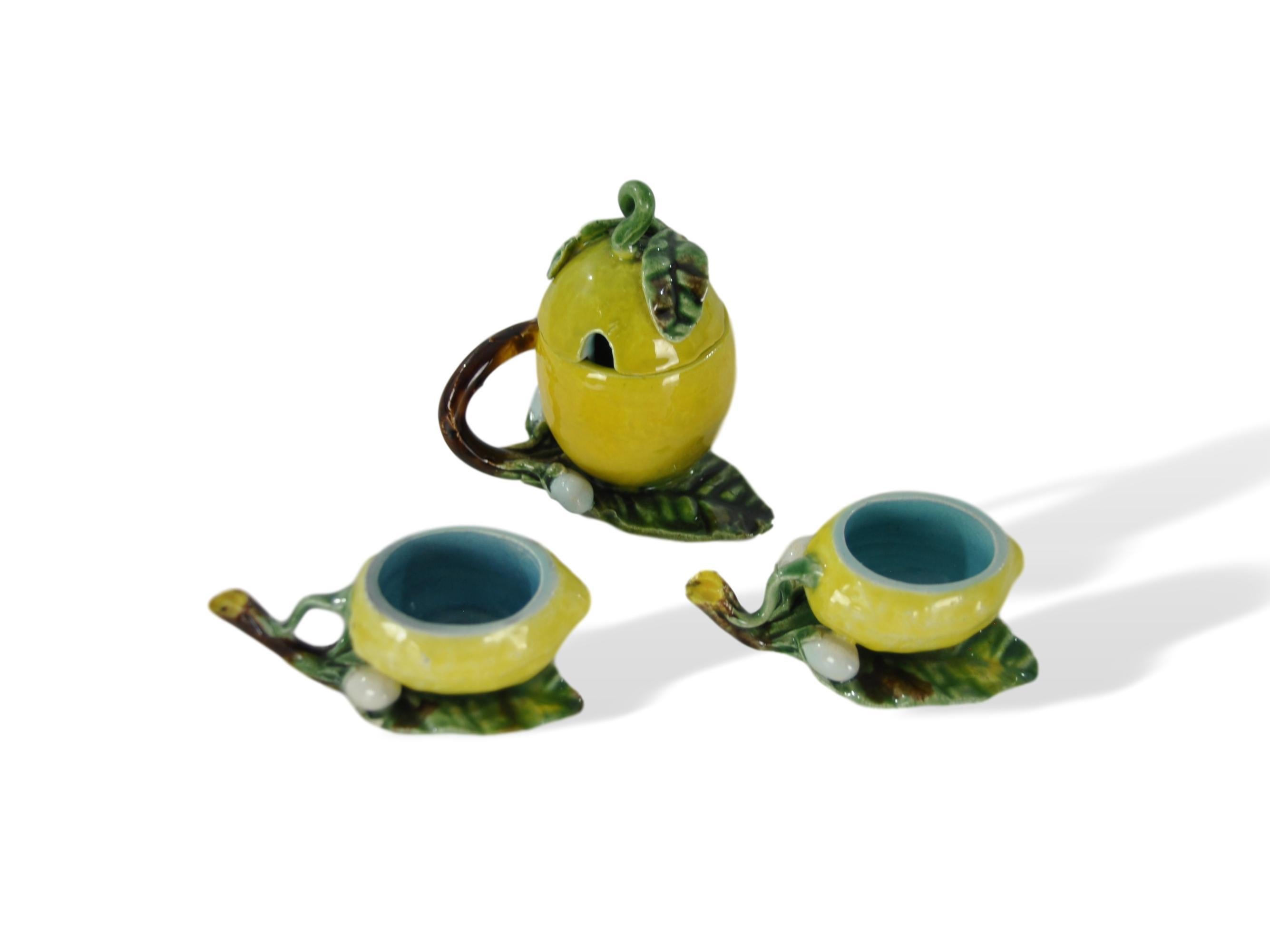 Menton French Majolica Barbotine mustard pot--a rare form with lid--and two salt cellars, circa 1885. 
For over 28 years we have been among the Nation’s preeminent specialists in fine antique majolica. 