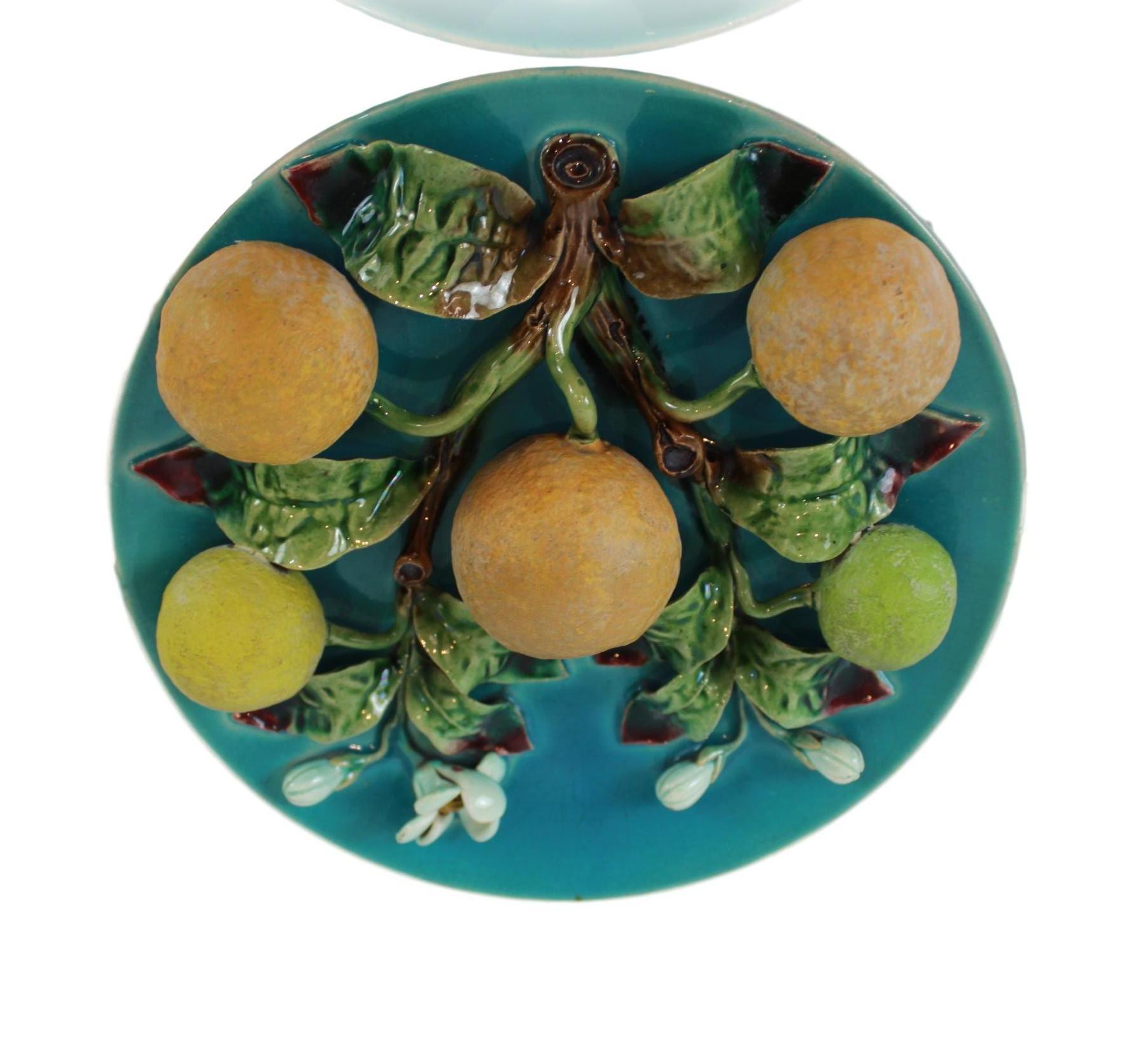 Menton French Majolica Barbotine wall plaque on a turquoise ground with oranges molded in high relief, circa 1880, diameter 8 inches.
Generally referred to as 
