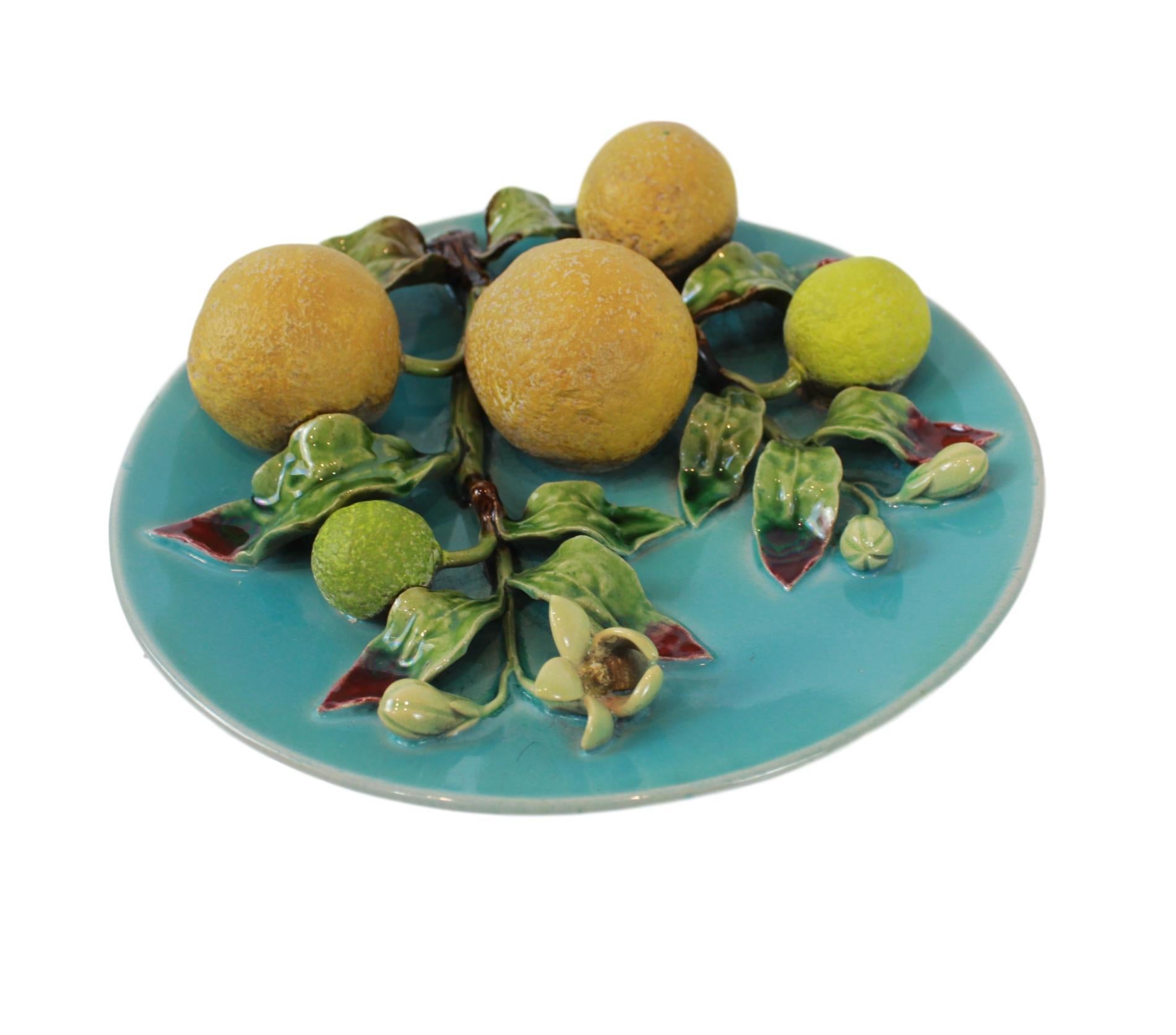 Menton French Majolica (Barbotine) Trompe L'oeil Wall Plaque on a turquoise ground with oranges molded in high relief, circa 1880, with impressed mark for Eugene Perret-Gentil, diameter 8 inches.
Generally referred to as 