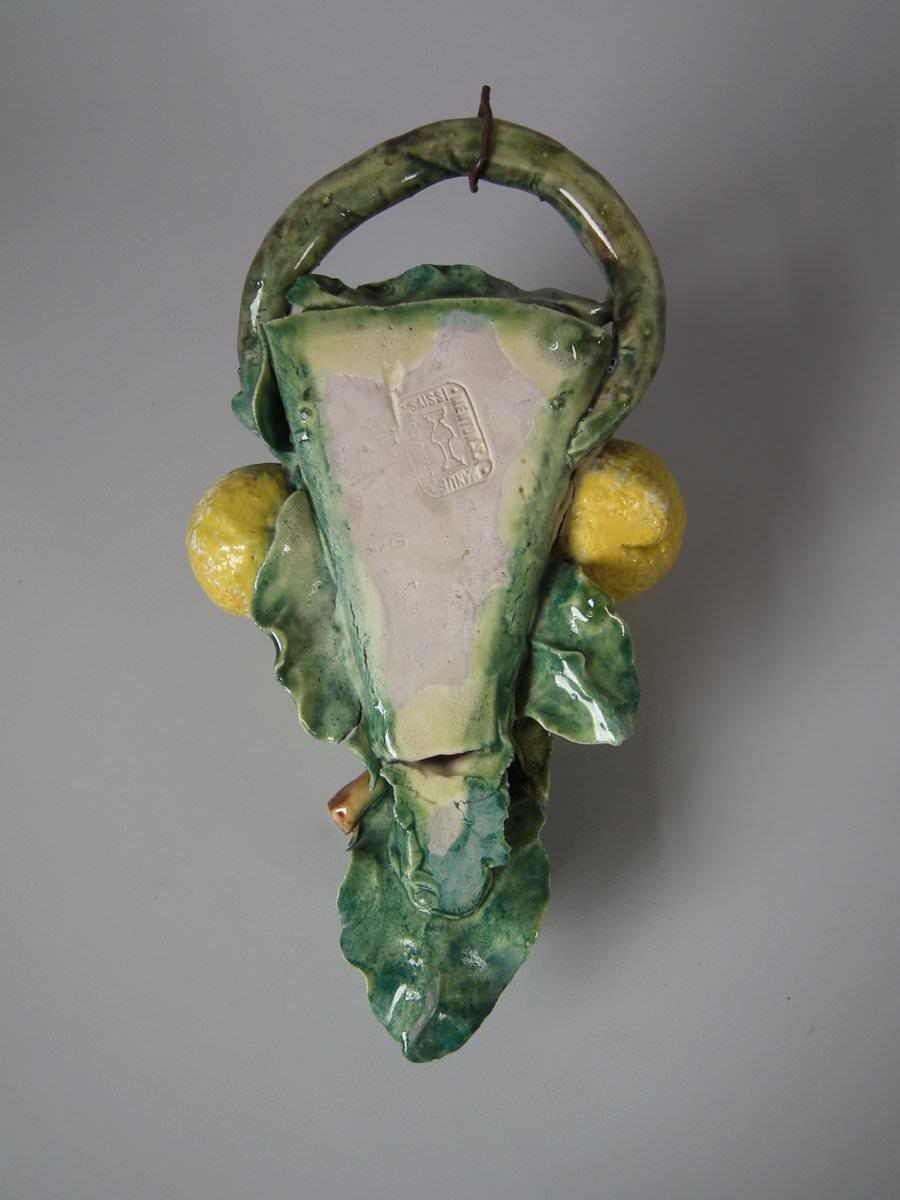 Joseph Saissi, Menton Majolica wall pocket which features lemons, leaves and flowers. Colouration: green, yellow, cream, are predominant. The piece bears maker's marks for the Joseph Saissi pottery.