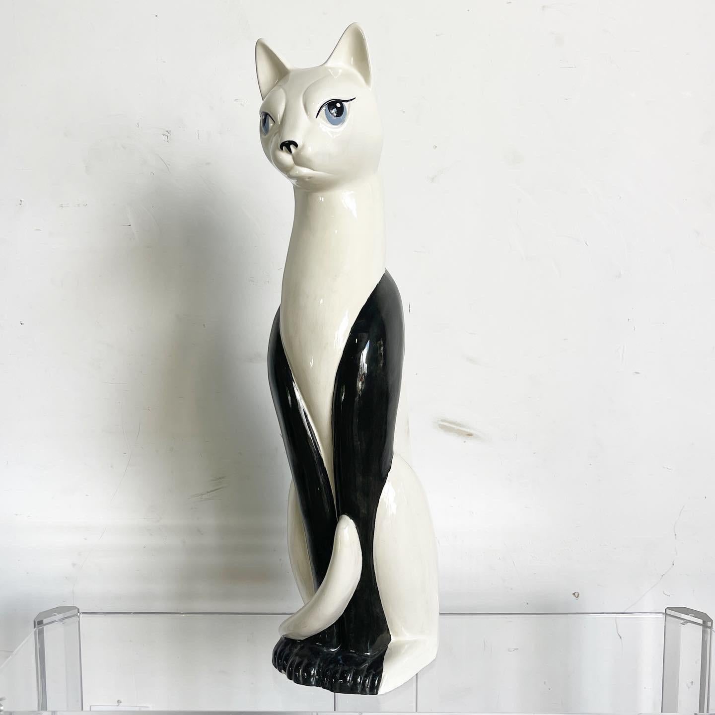 Embrace whimsical charm with the Hand Painted Ceramic Cat Sculpture, a unique piece that merges mid-century modern aesthetics with feline allure. Its graceful curves and hand-painted details transform a common pet into a stylish art object, adding
