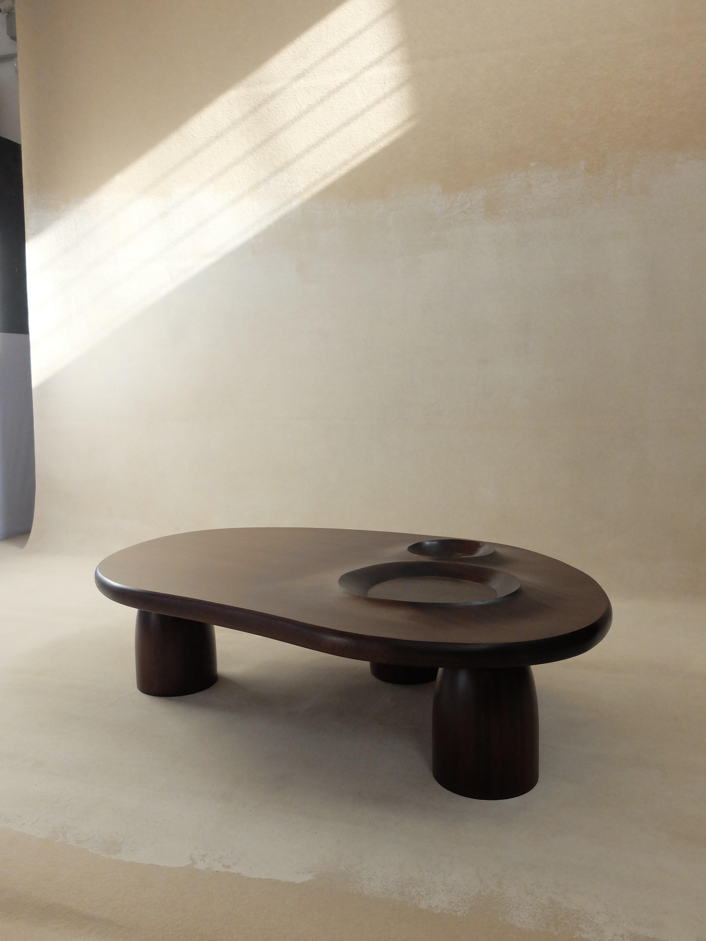 Mer et Cratère Table by Altin
Designed and developed by Yasmine Sfar and Mehdi Kebaier.
Dimensions: D 130 x W 90 x H 35 cm
Materials: Wood.

Hand-carved wooden table.

Orbit
A journey to a new dream world that we could call «home».
Original