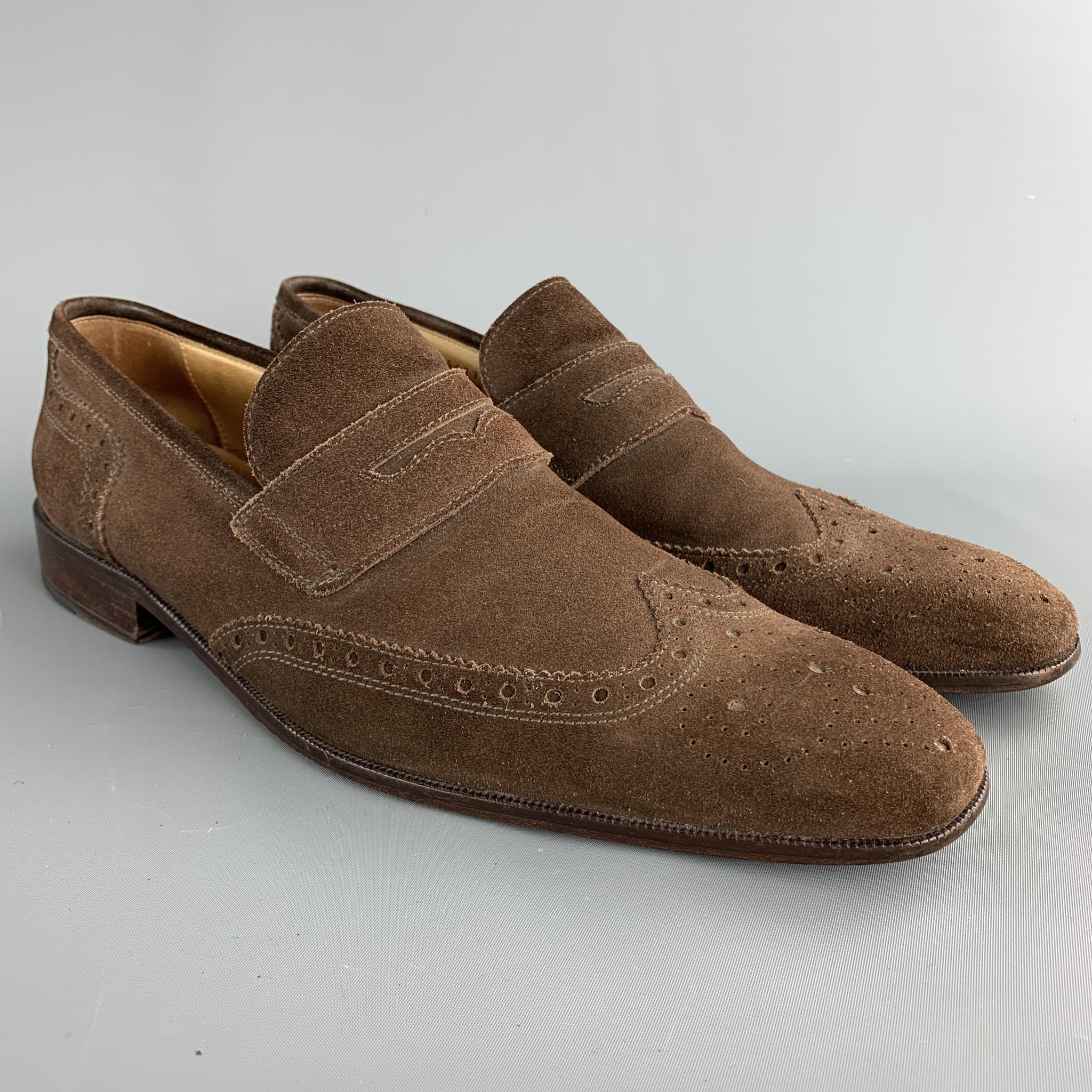 MERCANTI FIORENTINI loafers comes in a brown perforated suede featuring a wingtip, penny strap, and a wooden sole. Made in Italy.  

Excellent Pre-Owned Condition.
Marked: 12 M

Outsole:

13 in. x 4 in. 

SKU: 75330
Category: Loafers

More