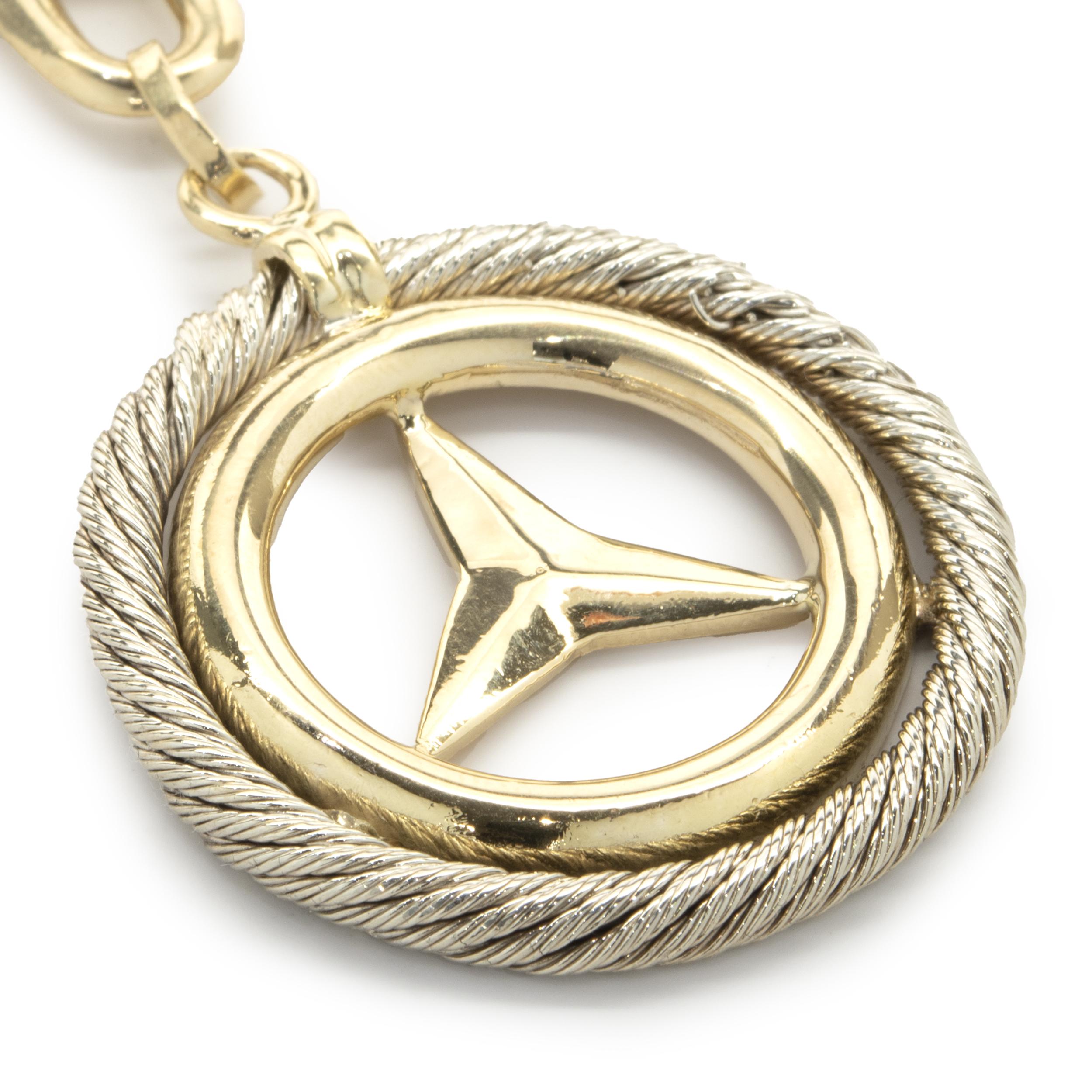 Designer: Mercedes
Material: 18K yellow & white gold
Weight: 27.27 grams
Dimensions: key ring measures 3.5 x 1.5-inches 
