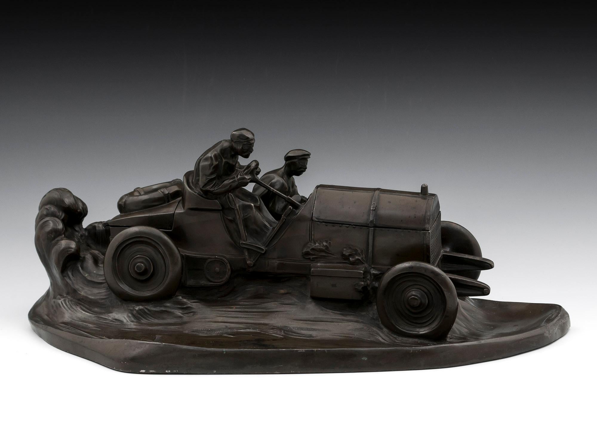 Bronze patinated pewter Mercedes Benz racing car inkwell and pentray, with stamp holder under the boot and inkwell under the bonnet; by Kayser of Germany. Stamped on the back W. Zwick 