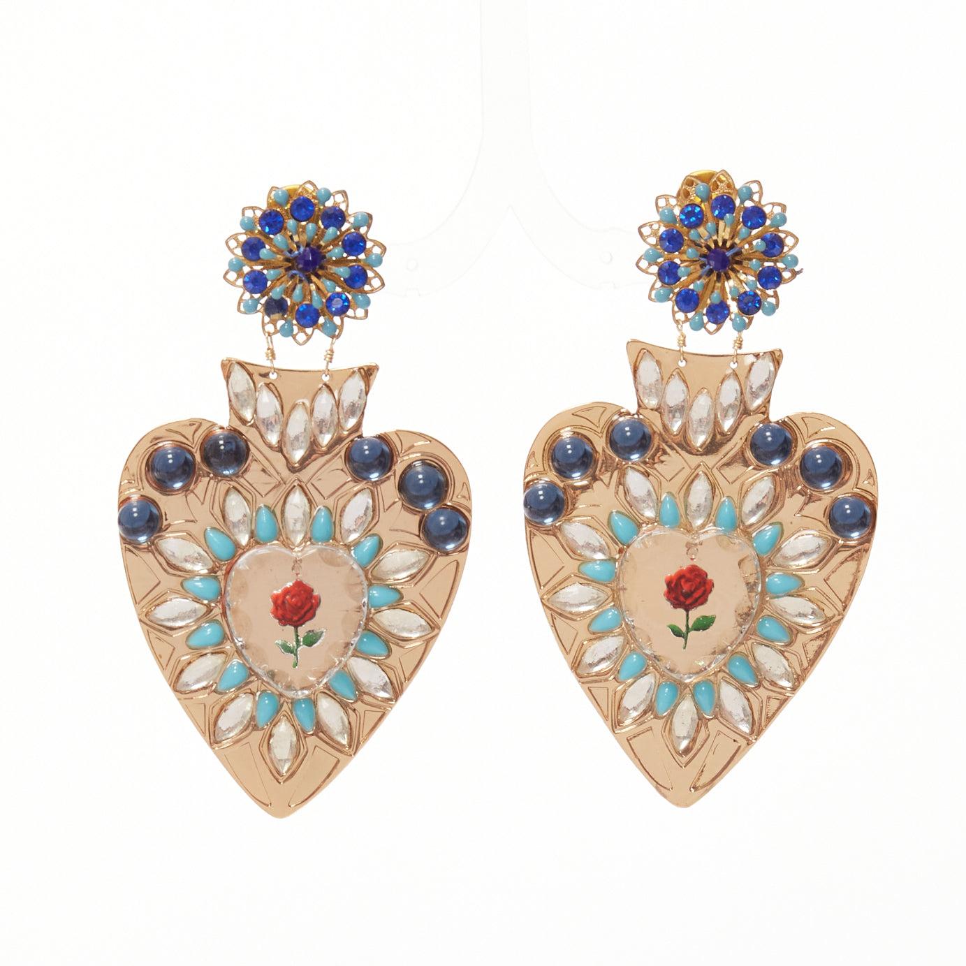 MERCEDES SALAZAR blue red heart resin crystal rose dangling clip on earrings
Reference: AAWC/A01224
Brand: Mercedes Salazar
Material: Metal
Color: Gold, Multicolour
Pattern: Crystals
Closure: Clip On
Lining: Gold Metal
Extra Details: Logo at back of