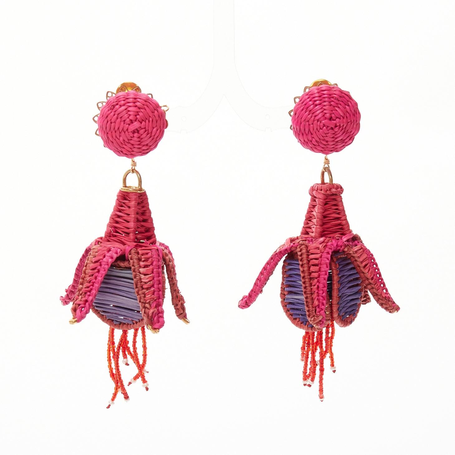 MERCEDES SALAZAR hot pink purple raffia weave bell flower clip on earrings
Reference: AAWC/A01245
Brand: Mercedes Salazar
Material: Raffia
Color: Pink, Purple
Pattern: Floral
Closure: Clip On
Lining: Gold Metal

CONDITION:
Condition: Excellent, this